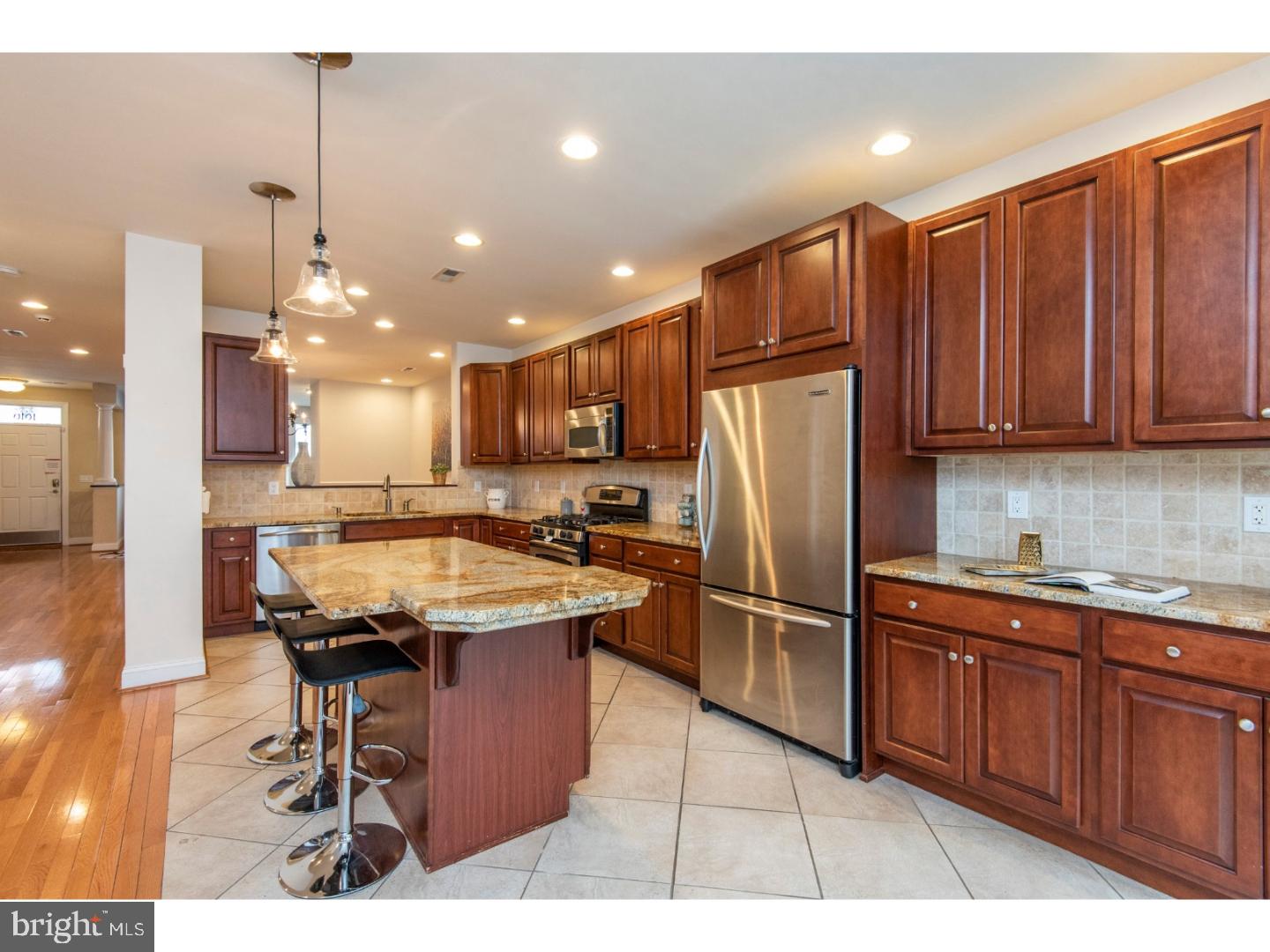 Stop what you're doing, and take a look at 1616 Green Street! Featuring 4 beds, 4.5 baths, a huge 2 car garage with access to an additional 3rd space in the easement right outside the garage, and over 5,000 square feet of living space including multiple outdoor entertaining spaces and an in-law suite with an additional full bathroom; prepare to fall in love. The open layout of the first floor makes entertaining a dream, so be ready to host many holidays and parties. The formal living and dining room flow back to the spacious kitchen, which features solid wood cabinetry, stainless steel appliances, granite counters, and a massive center island where everyone is sure to gather. Off the rear of the main floor is a large patio for grilling and dining al fresco . On the second floor, you'll find two bedrooms, both with ample closet space and private, en suite bathrooms. Up another flight is the sumptuous master suite, that will provide you with a true retreat. With a large bedroom, sitting area, over-sized closets, and a spa-like bathroom, you'll never want to leave. But keep exploring, because the best is yet to come. Continue up to check out the massive roof deck; the largest in the community. Complete with a built-in outdoor kitchen, seating area and dining area, it may be hard to believe, but there's even room for a hammock! Pretend you haven't already fallen in love with this house, and take a peak at the basement, which was designed by the current owners. A gas fireplace, full wet bar, and full bathroom take care of all your creature comforts. In addition to all of this, there's an in-law suite over the garage. Just when you're thinking this can't possibly get any better, wait until you discover the location. Within walking distance of St. Stephen's Green, where you can get one of the best burgers Philly has to offer, as well as Osteria for some amazing Italian food, all that Philadelphia has to offer will be at your fingertips. Don't miss your chance to call 1616 Green Street your new home, schedule your showing today! Property is part of the Spring Garden Historic District.