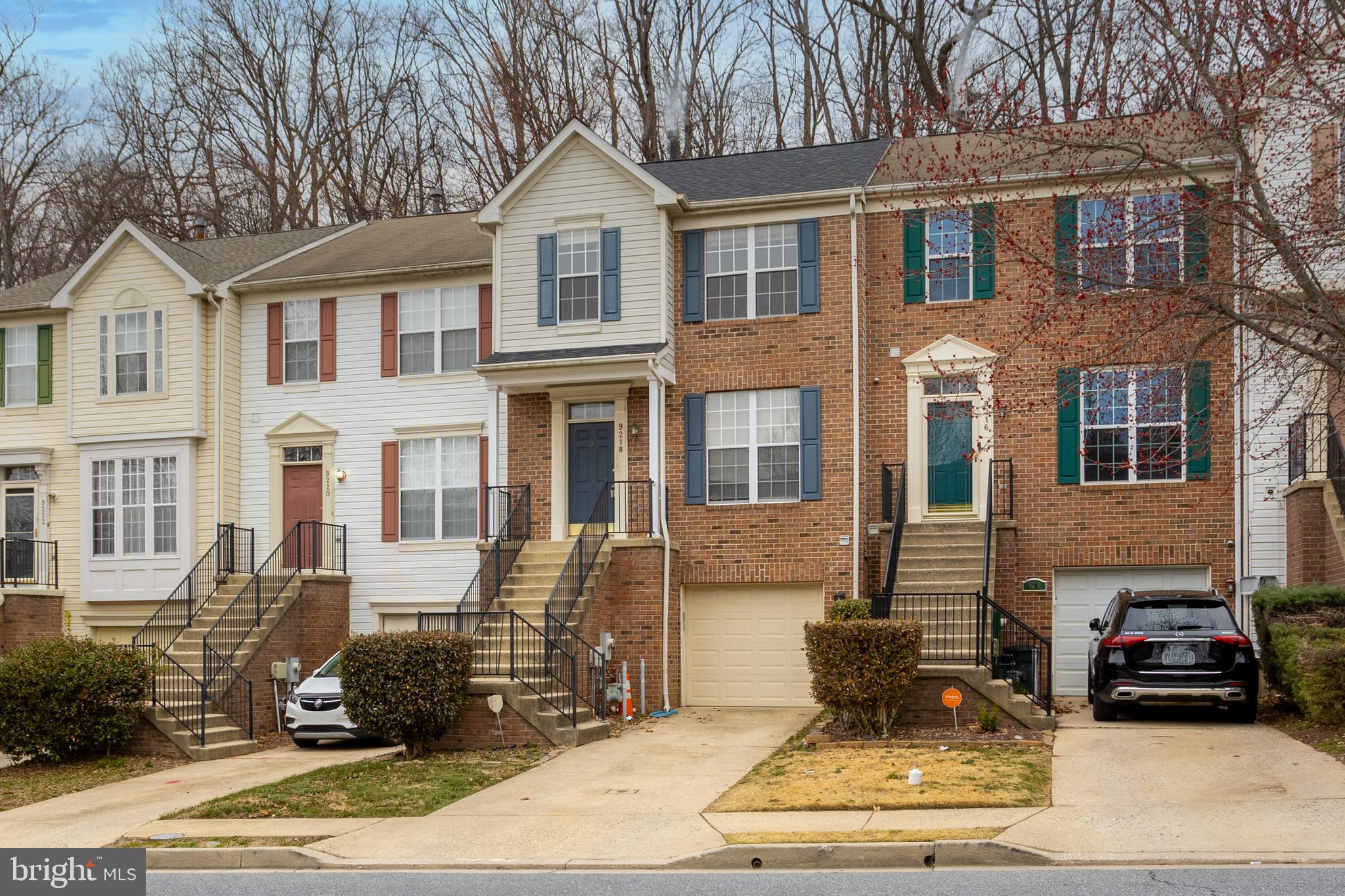 Welcome to 9218 Owings Choice Court in Owings Mills, a beautiful brick-front, three-level townhouse with a one-car garage that is truly move-in ready.

This spacious home features 3 bedrooms, 3 full bathrooms, and 1 half bath, offering the perfect layout for comfortable living and entertaining. As you enter the home, you will appreciate the warm wood and laminate flooring throughout the living and dining areas, and upper levels, while kitchen and the lower level features durable ceramic tile flooring.

The main level offers an inviting layout with a bright living room, dining room, and an kitchen designed for both everyday living and entertaining. The kitchen features new granite countertops, a center island with seating space, a wall oven, cooktop, a brand new refrigerator, and plenty of cabinet storage. Just off the kitchen, step through the french door to a huge deck overlooking a fully fenced backyard, perfect for relaxing, grilling, or entertaining guests.

The lower level provides excellent additional living space with a large recreation area, a cozy fireplace, and a full bathroom, making it ideal for a family room, guest suite, home office, or entertainment space.

Upstairs you will find three well-sized bedrooms, including a generous primary suite with cathedral ceilings, a large walk-in closet, and a private bathroom featuring dual sinks and a shower.  The other 2 bedrooms are of good size.

Major system updates provide peace of mind, including a roof that has been replaced in recent years, along with updated HVAC and hot water heater systems.

Located in a convenient Owings Mills community, this home is just minutes from shopping, restaurants, and many local amenities, making everyday living incredibly convenient.

Priced to sell and ready for its next owner, this home will not last long. Schedule your showing today and bring your offer. Call For private tours.  Some photos have been virtually staged