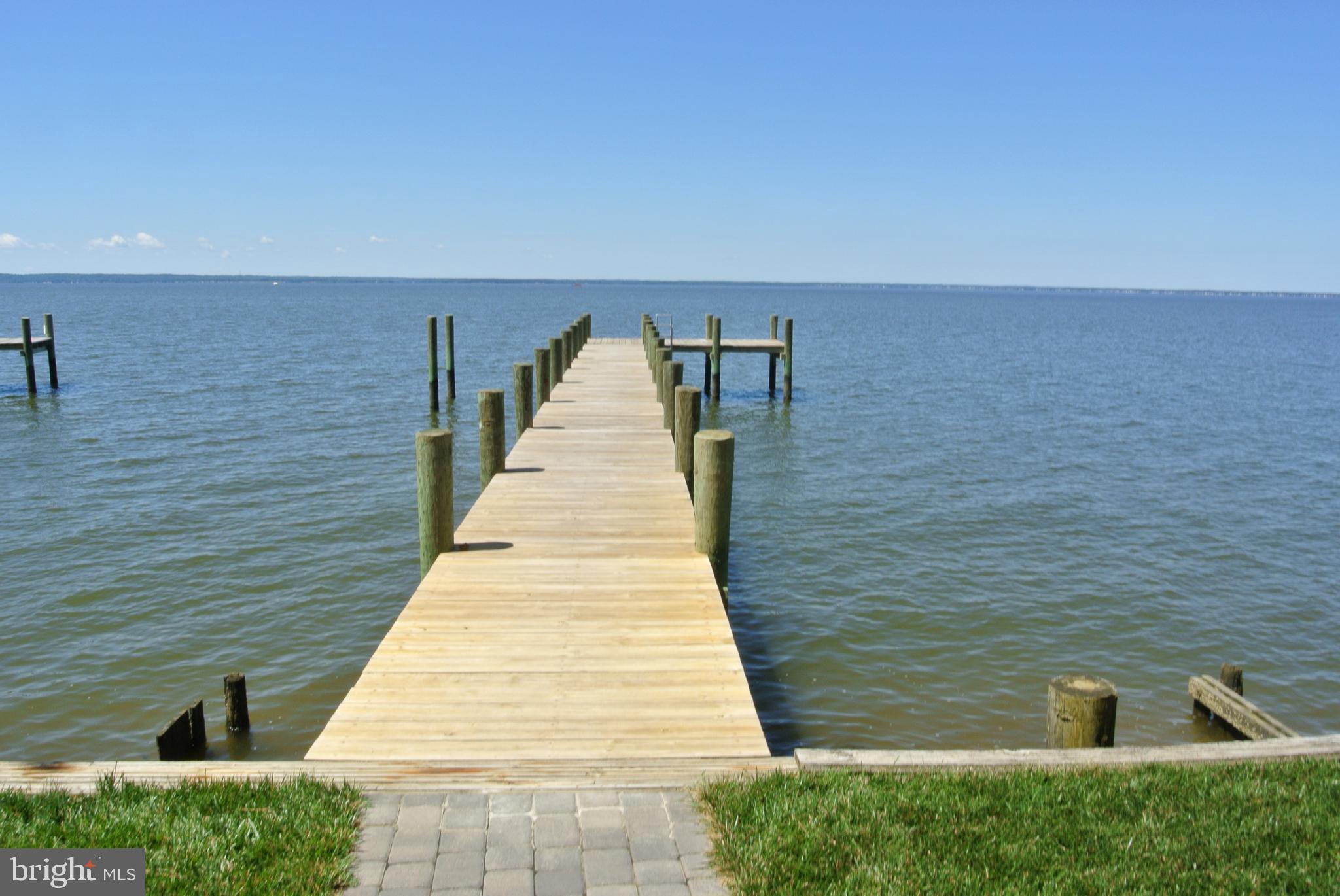 Relax on the Rear Deck and Enjoy the Panoramic Water view. Throw the Crab Pot in from your own Pier, Or jump on you Boat or Jet Skis. Whether this is your weekend home or your year round castle, you will quickly become acclimated to the "Island Life".  Golf carts permitted in this Island Community.  Short walk/ride to fantastic Waterfront Seafood Restaurants.  This immaculately maintained home boasts New Stainless Steel Appliances including a 36" Thermador Range, Bosch Dishwasher and High end GE Refrigerator.  Other amenities include a wood paneled elevator, massive First Floor Master, Second floor Sitting Room and second Master Suite, Sun-room,  Screened In Gazebo, Composite Deck, 100Ft - 4 year old Pier.  The AC unit was installed in 2019 and the roof was new in 2020.  The list goes on & on.  Just minutes from Swan Point Golf and Country Club.  Move In Ready.