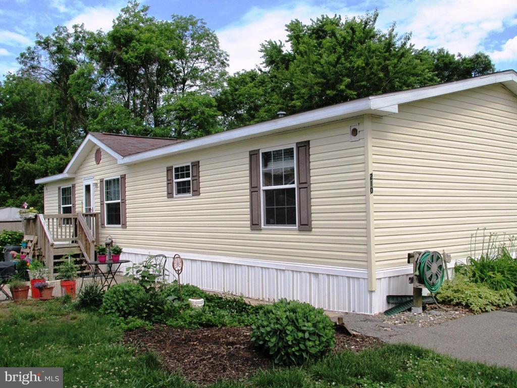 Dbl wide Mobile in Boone's Estates offers over 1240 sq ft of living space. New HAVC, carpet & paint - Ready to go!  Master BR separate from other BRs at opposite end of the home.  Community Amen. include pool, tennis and basketball courts and tot lot for the kids. Park application and approval must be secured. Showings after 6pm weekdays and on weekends.