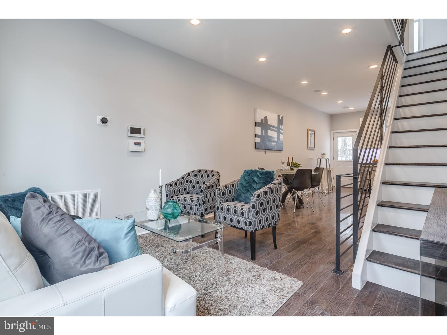 Feast your eyes on this amazing New Construction row home in red hot Fishtown! Featuring 3 bedrooms, 3 full baths, finished basement, roof deck, and all the high end luxury that you desire. Enter into the open layout first floor with effusive natural light that beams through the large front window, above door transom, and kitchen windows. The space is big enough for entertaining family and friends, but cozy enough for a quiet movie night. The beautiful wide plank hardwood floors continue throughout the home. The decked out kitchen is highlighted by the white shaker style cabinetry, perfectly paired counter-tops, stainless steel appliances and stunning tiled backsplash. On the second floor you will find two spacious bedrooms with ample closet space, laundry area, and custom tiled hall bath. The master suite takes up the entire third floor with a fabulous master bath with twin sinks, walk out balcony, and 2 large closets. The fully finished basement includes beautifully tiled floors and another full bath. Some other amazing features are the nest thermostat, security system, and surround sound audio systems. This home has been meticulously crafted by one of Philadelphia's most reputable developers. Schedule your visit today!