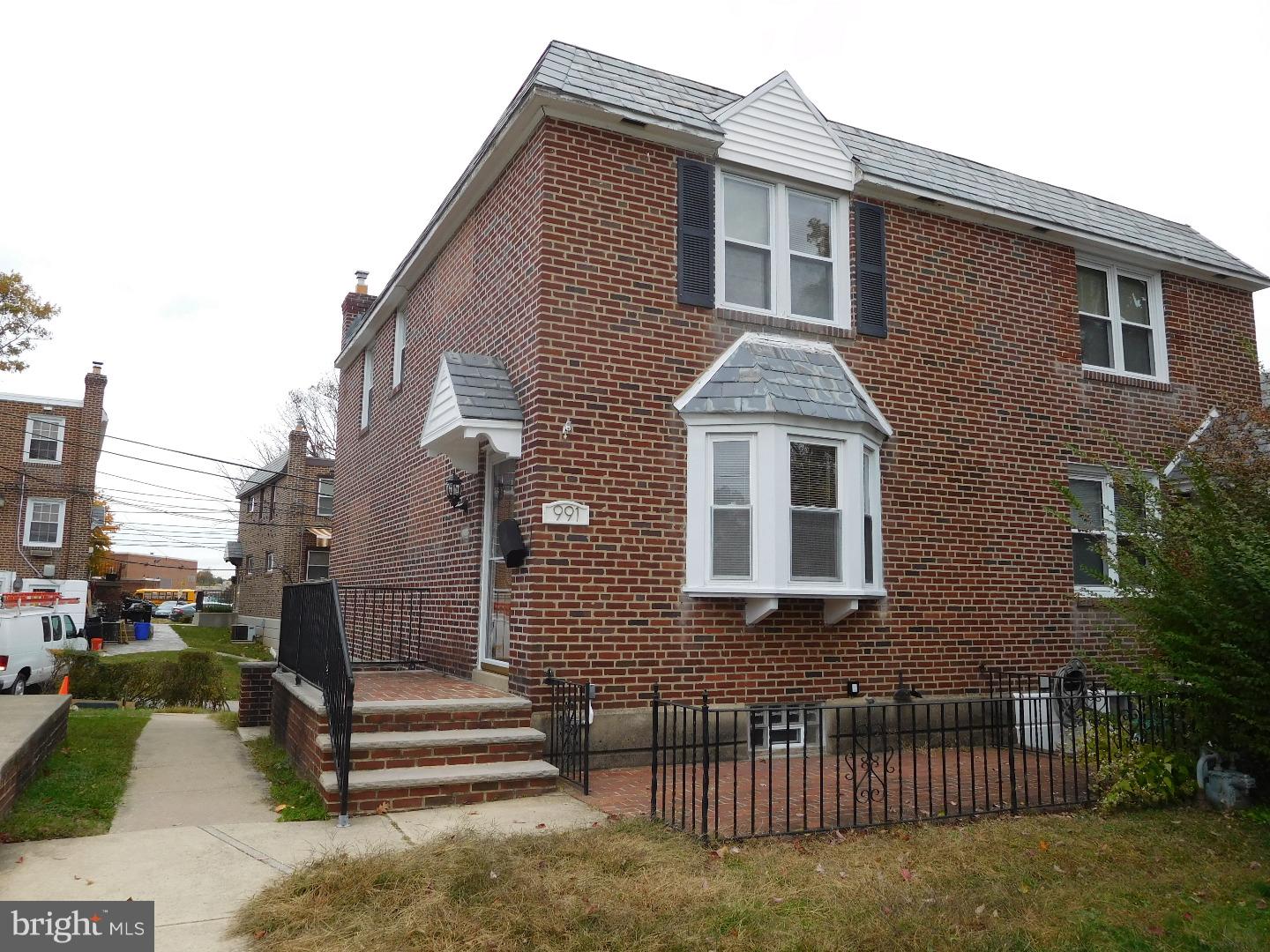Nicely renovated home with hardwood, granite and finished basement with rear parking. First floor: Living area is hard wood floors with modern lighting, nice Dining area and granite kitchen with new Stainless steel appliances. 2nd Floor: Modern bath with new plumbing and fixtures. 3 bedrooms with ample closet space. Basement is finished and offers much added space, and laundry hook up and walk out to rear. Ez to see and show.