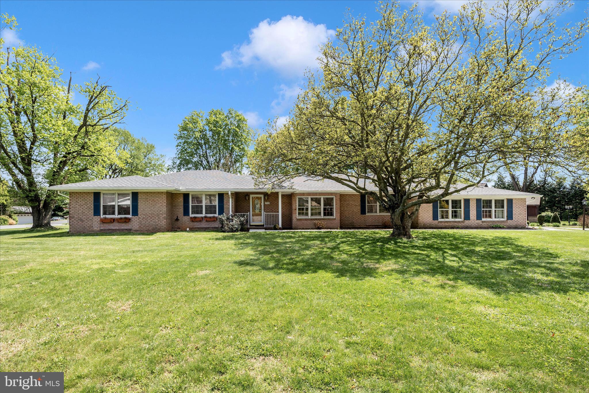 Welcome home to this spacious all-brick rancher with a covered front porch, perfectly situated on a large corner lot at the end of a quiet street.   Featuring a spacious private fenced backyard, this inviting property offers both comfort and tranquility in the desirable Fountainhead community—just minutes from shopping and everyday conveniences.  ***
With 2,900 finished square feet, this home is filled with warmth, character, and room to grow.  Inside, you’ll find four generously sized bedrooms, two and a half baths, and a thoughtfully designed layout that includes a bright and welcoming living room with a large box bay picture window, a formal dining room ideal for gatherings, and a spacious kitchen that overlooks the cozy family room with a gas fireplace—perfect for everyday living and entertaining. ***
A convenient laundry area sits just off the kitchen, leading to a charming den complete with beautiful built-ins—an ideal space for a home office, library, or quiet retreat. Hardwood floors guide you down the hall with a cedar closet to the primary suite with its own en-suite bath, along with three additional well-proportioned bedrooms.  ***
The expansive unfinished lower level offers endless possibilities—whether you envision a recreation room, fitness space, workshop, or additional storage. ***  And the enclosed patio provides a wonderful year-round haven to relax, entertain, and enjoy the natural surroundings.  ***
While being sold as is, updates for peace of mind include a new roof in 2023, new microwave – 2024, primary bathroom update in 2023, shutters and front walkway- 2025 ***
Lovingly maintained by the same owner for 30 years, this home presents a rare opportunity to add your personal touch and create the home you’ve always dreamed of. Come experience the space, comfort, and potential this special property has to offer.