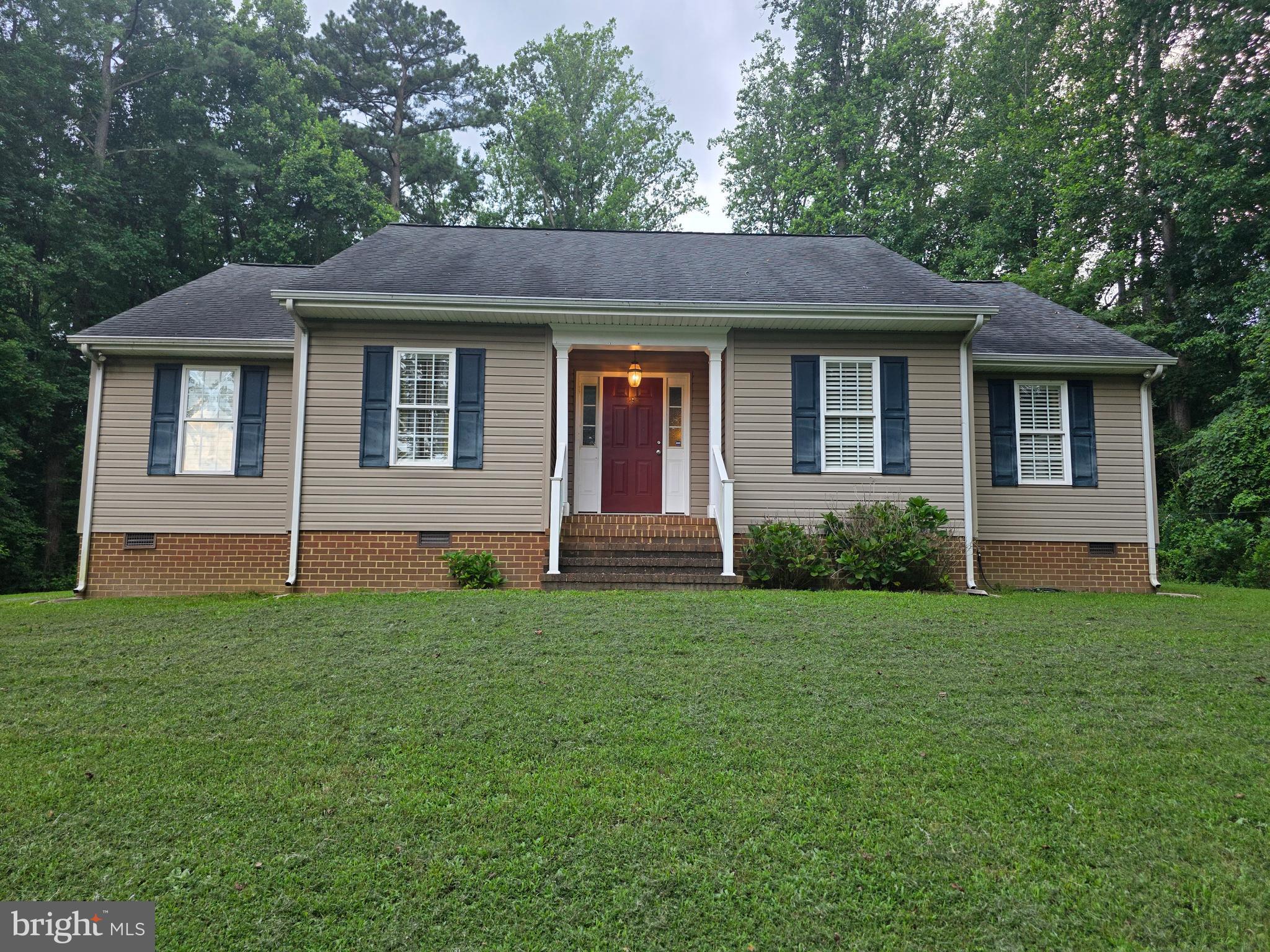 Perfect starter home or secluded retreat sitting on over 2 acres. This home comes equipped with hardwood flooring throughout the main living area and carpeted bedrooms. There's a spacious laundry room with shelving and a pantry to store those canned goods and snacks. The huge living room area that opens into the kitchen/dining area is a must see! Outside you'll find a nice yard that's secluded from the outside traffic. The huge back deck is perfect for kicking back and relaxing, while the tremendous backyard area has plenty of room for entertaining guests or having some family adventures. Don't miss out on this peaceful and serene atmosphere! Come see your personal daily getaway! Don't miss out on a great opportunity at one of the few completely peaceful properties available!!!