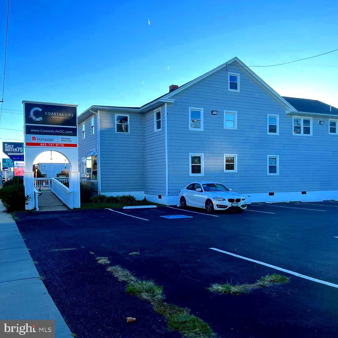 Welcome to 7501 Coastal Hwy - The PERFECT place to build your business! With four levels of work space and 5800(+/-) sq ft, the possibilities are endless! Right off of Coastal Hwy in Midtown OC guarantees a ton of exposure, with prominent signage right on the strip and plenty of parking in a private, paved lot. Enter the office to find a bright entry that will make your customers feel right at home. With a beautiful fireplace and open space for seating and a large TV or projector, this space is both welcoming and functional. The first level comes equipped with SIX enclosed offices, a large room perfect for meetings or communal workspace, two bathrooms, and two separate areas for supply storage. Head downstairs to find a large, open room at ground floor level with access to the alley behind the building and garage storage. Head up a wide, modern staircase to find another large space perfect for conducting meetings or communal work. This space leads out to a balcony facing 75th St for another entry point or employee breaks. Head up to the third floor to find even more - another FIVE enclosed office spaces, common areas and a kitchen and breakroom. Please contact listing agents for more information. Lease option is available for interested parties. Looks can be deceiving from the outside but you'll be amazed at the potential of this space! Come see it for yourself today!