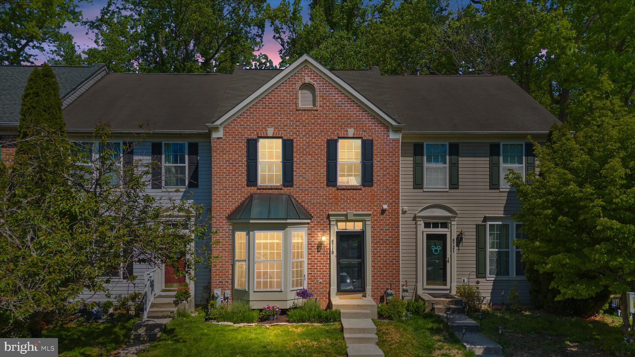 Tucked on a quiet court in Ellicott City, this brick-front townhouse offers a spacious, bright and relaxing place to call home.  
The main level is bright, with hardwood floors and a big bay window that brings in tons of natural light. The living room flows right into the kitchen, which is set up perfectly for both everyday living and having people over. The kitchen has granite countertops, a large island, white cabinets with black hardware, stainless steel appliances, and pendant lighting that pulls it all together. There’s also a slider out to the deck, so it’s super easy to take things outside. The dining area overlooks the trees which makes it feel a little more private and peaceful.
Upstairs, the primary suite feels like a true retreat with vaulted ceilings, great natural light, and those tree-lined views. The bathroom has a soaking tub, separate shower, and a clean, bright vanity. Two additional bedrooms upstairs are both a great size, also with vaulted ceilings, and share a full bath.
The finished lower level gives you a ton of flexibility — whether you need a second living space, home office, playroom, or guest area, it’s ready for whatever works for you.
Out back is where this home really shines. The multi-level deck leads down to a flagstone patio surrounded by mature trees and a fenced yard — perfect for hanging out, hosting friends, or just unwinding at the end of the day. There’s also a shed for extra storage and gated access.
All of this is in a convenient Ellicott City location — close to top-rated schools, Old Ellicott City, Centennial Park, major commuter routes, and plenty of shopping and dining.