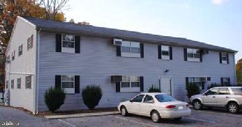 First floor apartment. 2 bedroom, 1 bath. Hook ups for washer and dryer. Refrigerator, stove/oven, dishwasher.  Large parking lot.  Large attic storage bin for each unit.  Electric baseboard heat. Rent includes Water, sewer, and trash. Tenant pays electric and internet/cable.  NO ANIMALS.