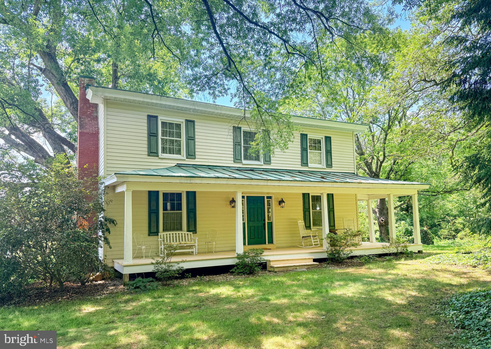 There are homes that simply provide shelter, and there are homes that tell a story. This beautifully preserved and thoughtfully expanded circa 1880 farmhouse is one of those rare places where history, comfort, and modern living come together.

Set on nearly 8 peaceful acres, the home was extensively renovated and expanded in 2005, carefully preserving the craftsmanship and character that make older homes so special while adding the conveniences today’s buyers appreciate. Original heart pine floors, antique doors, vintage hardware, soaring ceilings, beautiful moldings, and four decorative fireplaces create warmth and personality throughout.

With over 3,100 square feet, the flexible floor plan offers three private bedroom suites, including primary suites on both the first and second floors, making the home adaptable for changing needs, guests, or multi-generational living. The spacious kitchen serves as the heart of the home with abundant cabinetry, double wall ovens, gas cooktop, newer Samsung refrigerator, generous workspace, and an inviting sunroom that overlooks the property.

Step outside and you’ll discover porches on multiple sides of the home, a private deck off the first-floor primary suite, an outdoor fireplace, mature landscaping, raised garden beds, fruit trees, and one of the area’s most remarkable features—a majestic oak estimated to be more than 200 years old. Whether enjoying your morning coffee on the wraparound porch or watching the stars fill the night sky, this property offers a peaceful setting that’s increasingly difficult to find.

The A-2 zoning provides flexibility for a variety of rural lifestyles, and the seven outbuildings, barn, smokehouse, former barber shop, and additional accessory structures offer incredible opportunities for hobbies, storage, workshops, gardening, or future projects.

Additional improvements include replacement windows throughout, updated electrical during the renovation, zoned heat pumps, a four-bedroom septic system, and an electric pet fence. Located just minutes from Pleasants Landing at Lake Anna while remaining convenient to Richmond, Fredericksburg, Ashland, Mineral, and Louisa, this property offers the perfect balance of country living and accessibility.

If you’ve been searching for a home with authentic character, modern comfort, usable acreage, and room to make it your own, 1311 Borden Road is a property you’ll want to experience in person.