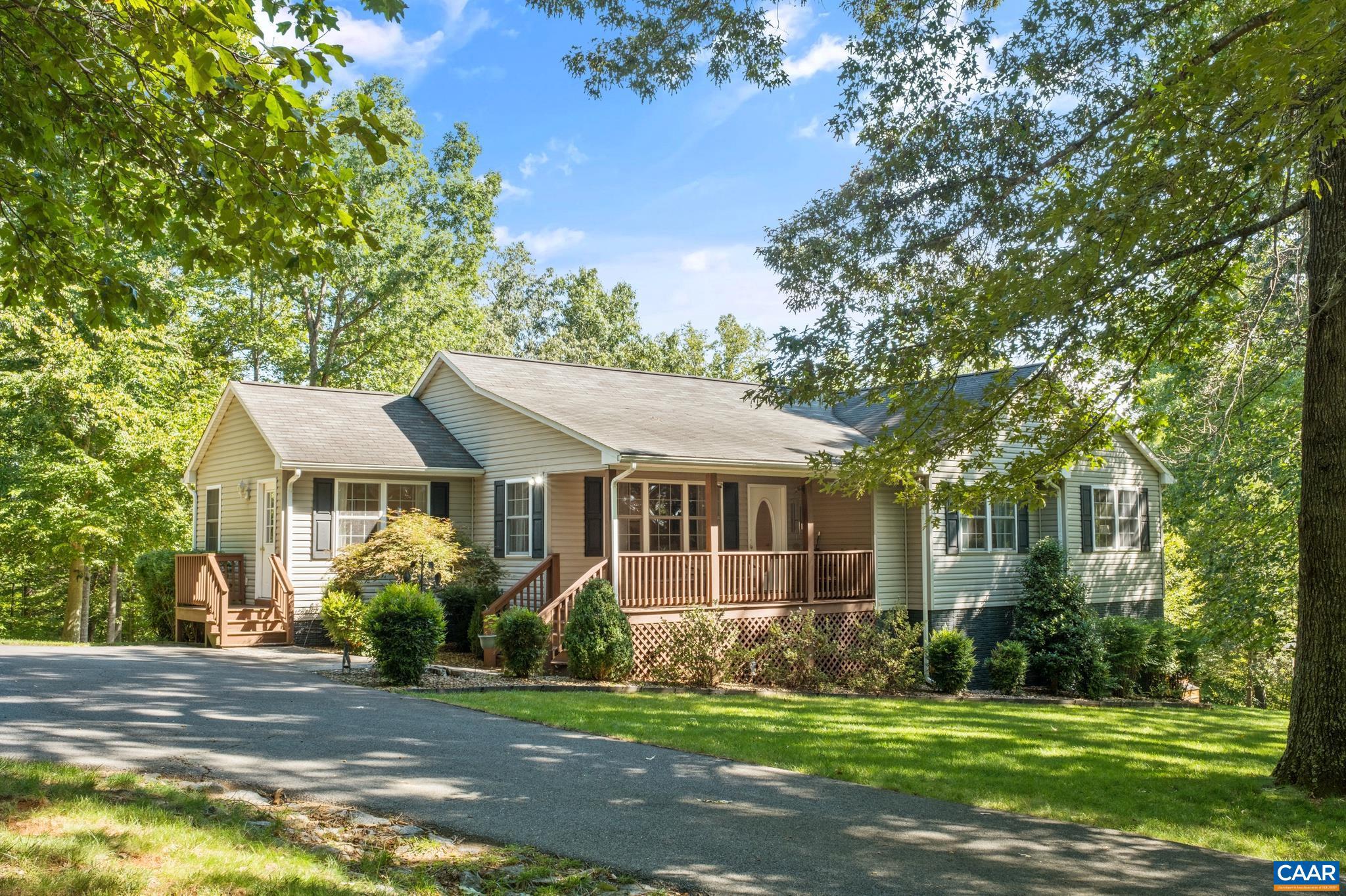 Immaculate one owner, custom built home situated on nearly 5 acres.  Perfectly sited to enjoy privacy, nature and wildlife from the covered front porch or rear deck.  Property has been well maintained and features many upgrades throughout.  Numerous bonus/living spaces make it ideal for entertaining or working from home (FIREFLY internet installed!)  Main level offers living room, renovated kitchen with quartz tops & stainless steel appliances plus an extra sitting room; Primary bedroom with renovated bath & walk in closet; and two guest bedrooms & a renovated hall bath.  Lower level is an entertaining paradise featuring Renovated game room with built-in bar, plus a separate TV area.  An extra finished room is perfect for your home office.   Wait!  There is more!  Detached garage for housing vehicles or working on projects, raised beds for gardening and a chicken house, too!  This home truly is a must see!  Located minutes from Nelson 151 activities ? brew/wine trail, Nellysford Farmers Market, Wintergreen Resort and only 35 minutes to Charlottesville.,Oak Cabinets,Quartz Counter