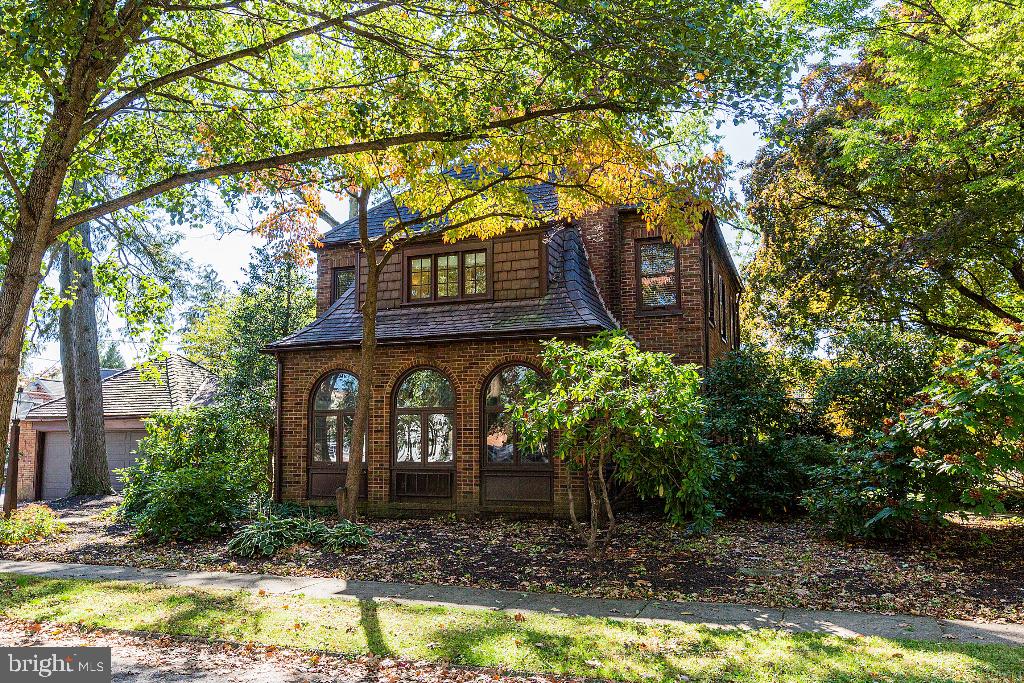 Welcome to 1068 Louise Avenue in lovely Grandview Heights, Manheim Township. This home was built in 1930 as the personal home for a building contractor. Attention to detail and character abound in this stately brick, two and a half story home.    Interior features include four bedrooms with a possible fifth bedroom on the third floor, three full baths. The primary bedroom has a private bath that is beautifully renovated with large, tiled shower and tiled floors.  Additional features found throughout the home are arched doors and doorways, oak wood trim, oak window frames and hardwood flooring throughout.  The home is heated with natural gas and cooled by central air conditioning.  The kitchen features stainless appliances and gas cooking plus plenty of storage.  The kitchen opens to a cozy family room with a wood burning stove and has access to a large, tiered, deck and private side yard.  The living room showcases a wood burning fireplace with a beautiful mantel and connects to a spacious, light filled, sunroom as well as a formal dining room. The roof is constructed of sturdy terra-cotta tiles. The garage accommodates two cars with storage above.  The Grandview Heights neighborhood is known for its walkability and convenience to major roads, Lancaster City, healthcare facilities, restaurants, and entertainment.  Shown by appointment only, so please schedule your showing today