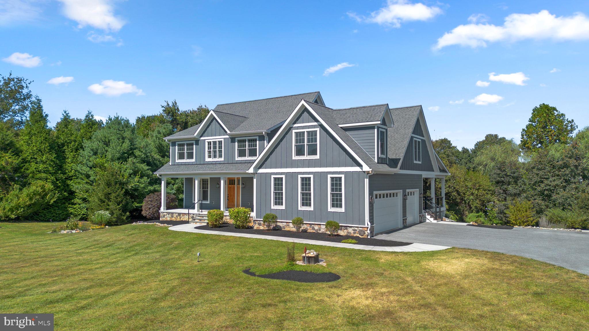 Proudly presenting 13492 Allnutt Lane in Allnutt Farms — a masterpiece of craftsmanship and architectural design located within the River Hill High School district. Built in 2019 by Raphael Homes, in collaboration with GBL Custom Home Design, this residence blends timeless Craftsman architecture with high-end finishes and advanced technology. Every detail was thoughtfully designed to create a home that is as functional as it is beautiful. **Highlights & Lifestyle Features** -- Outdoor Living at Its Best: Five covered spaces including an expansive front porch, screened rear porch, two covered patios, and a permanent outdoor kitchen with grill, burners, and even an outdoor shower -- Private .91 Acre Lot: Flat, usable land with native plantings, mature landscaping, multiple exterior water sources, and a large equipment shed with water and electricity -- Luxury Kitchen & Entertaining Hub: A gourmet chef’s kitchen with quartz counters, Viking six-burner gas range, Bosch appliances (including wall oven, warmer drawer, dishwasher), beverage cooler, Kraftmaid cabinetry, and a walk-in pantry with built-ins -- Thoughtful Design Throughout: White oak flooring, custom tile accents, premium fixtures, Hunter Douglas window treatments, and a stunning Heat & Glo fireplace create warmth and elegance -- Flexible Living Spaces: Private home office, library with built-ins, expansive bedrooms, and multi-generational/in-law potential with a true fifth bedroom and full bath in the above-grade basement -- Owner’s Retreat: Vaulted-ceiling primary suite with an oversized walk-in closet featuring custom built-ins, spa-like bath with soaking tub, seated shower, dual vanities, heated towel rack, and private water closet -- Smart Comfort: Zoned/programmable thermostats allow customized for five zones throughout the house -- **Additional Features** -- Hardie Plank siding, architectural shingle roof, Anderson windows, composite decking, exterior lighting -- Three-car side-load garage with abundant storage -- Mudroom with reclaimed brick walkway and generous storage solutions -- Upper-level and basement laundry facilities-- Media room and additional storage rooms in basement. **Why This Home** High quality boutique custom craftsmanship -- Every element reflects thoughtful design, comfort, and long-term durability -- It is pristine, move-in ready, and available for immediate delivery -- Buyers will feel the difference the moment they arrive — this is not just a home, but an experience. For a full features list and private showing, contact us today. Note: Some images have been virtually or staged or painted. Ask for additional information.