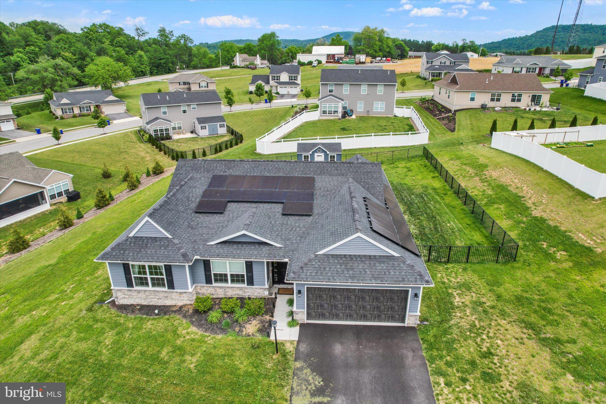 MODERN RANCHER!  NEARLY NEW!  ONE LEVEL LIVING AT ITS BEST!  No Basement - No Stairs!  This 3 BR, 2.5 BA is MOVE IN READY.   Additional Sunroom Sitting Area and Office hosts extra space for entertaining and still have a private office for your purposes.  The long windows bring in a lot of natural light.  Enjoy your morning coffee on the back patio.  The wall accents add to the comfort and balance of defining spaces in the open area.   In a short time, this owner has added a 10 x 16 shed, fenced in back yard, a whole house water filtration system with a reverse osmosis system installed in the kitchen, luxury vinyl flooring, and solar panels.  Solar panels allow the owner to earn income on the extra energy that is produced while maintaining a set price on the electric bill.  Perfect location for commuters using Route 15; Near enough to shopping, entertainment and restaurants, yet provides a rural feeling; Only a few minutes from farm markets, Giant, Trader Joe's, schools, hospitals and other services.  Schedule your showing today!  Seller looking to settle as soon as possible.  Home is Nearly New!  Remember, even new construction isn't going to give you this space at this location, at this price with a shed, solar panels, water filtering system, wall accents, and a fenced in back yard!  See you soon!