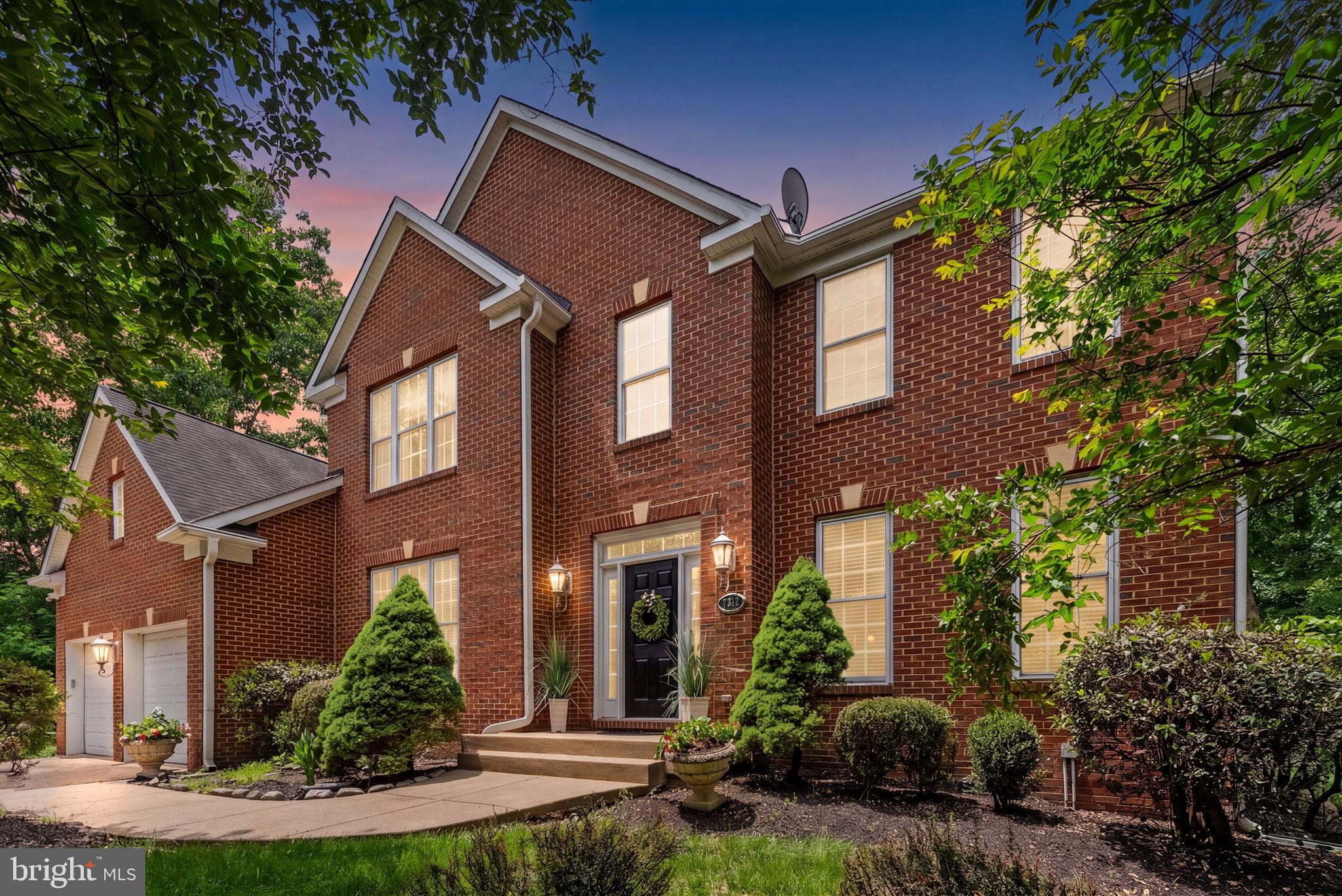 Located on a private, tree-lined 1.5-acre lot with no HOA, this brick-front Colonial offers 5,800 square feet of finished living space across three completed levels. The property is zoned forGainesville High School  and sits just minutes from local shopping, dining, and major commuter routes.

The main floor features a spacious layout centering on a two-story family room with high ceilings, which connects directly to the gourmet kitchen and an attached eat-in sitting area. This level also includes a dedicated home office, formal living and dining rooms, and a powder room, all finished with luxury vinyl plank (LVP) flooring. Convenient access is provided to the two-car garage, which is equipped with an EV charger.

Upstairs are four spacious bedrooms and three full bathrooms. The primary suite includes an attached bathroom, two walk-in closets, and a secure, built-in secret/safe room. A second bedroom includes its own en-suite bathroom, while the remaining two bedrooms share a full hall bath.

The finished walk-out lower level adds substantial living space, configured with a large wet bar, a full bathroom, and two separate flex rooms well-suited for a home gym, media room, or guest quarters. Additional functional features include a central vacuum system and a whole-house water treatment system.

Outside, the 1.5-acre lot offers plenty of privacy and includes a rear patio for outdoor seating. A large, paved additional parking area provides ample space for extra vehicles, a boat, or recreational equipment. This property combines rare acreage and independence with proximity to everyday conveniences.