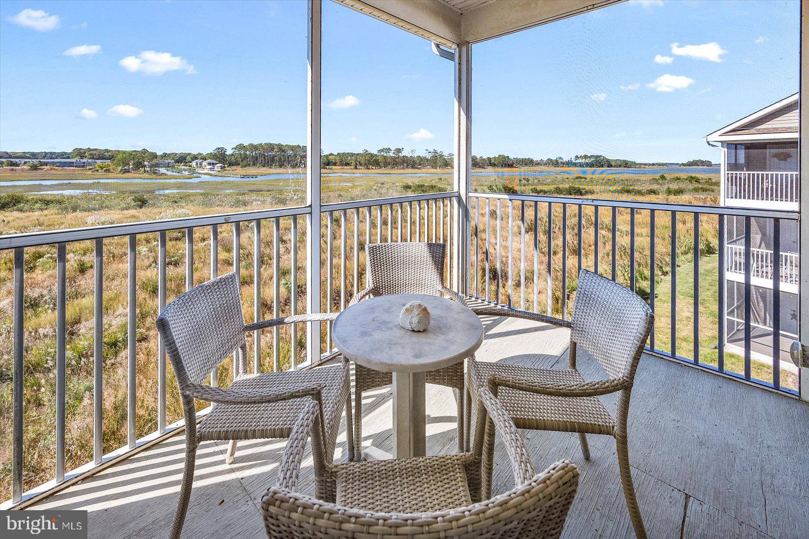 Coastal waterfront living at its best! Located in the sought after resort community of Bethany Bay. Enjoy spectacular waterfront views from this 4 bedroom, 4 bath, end unit flooded with natural light. Panoramic views overlooking the Indian River Bay in amenity-rich, waterfront golf course community. Many upgrades throughout including a gourmet eat in kitchen with granite countertops and stainless-steel appliances. Luxury vinyl flooring throughout the unit including upstairs. Open floor plan. Great for entertaining friends and family. Spacious living space with views from every window. Fireplace. Custom window treatment, custom painting, custom light fixtures, and ceiling fans. Recessed lighting. Light and bright. Well cared for and maintained. Ample storage throughout the unit includes large closets, outdoor storage closet on the screen porch and detached 1 car garage. Plenty of guest parking. Outdoor living space includes large waterfront screened in porch, front porch which has pond views with sensational sunrises. Gorgeous sunsets over the bay and beautiful nature scapes. Frequent sightings of indigenous waterfowl. Capture beautiful sunrises from the front porch. Lush landscaping throughout the community. Perfect for water enthusiasts to enjoy a day on the bay kayaking, paddle boarding, or boating from the community boat ramp and kayak launch. Close to some of the finest fishing on the East Coast. Located in the waterfront community situated on 420 lush acres with protected wetlands, offering an array of amenities including a beautifully maintained 9-hole golf course with pro shop, outdoor swimming pool with spa, clubhouse with fitness center, boat ramp/kayak launch, and fishing pier, tennis and newly installed pickleball courts, basketball, volleyball courts, ping pong in clubhouse, tot lot, miles of nature trails, manicured lawns with sidewalks, water features and more! Great location within the community. Easy walk to all the amenities. Just 3 miles from Bethany Beach and Boardwalk, fabulous local restaurants, and tax-free shopping. The perfect beach home, excellent rental investment or year-round living. 2024 the property grossed about $51,000 and 2025 the property grossed about $49,000. Property is sold furnished.