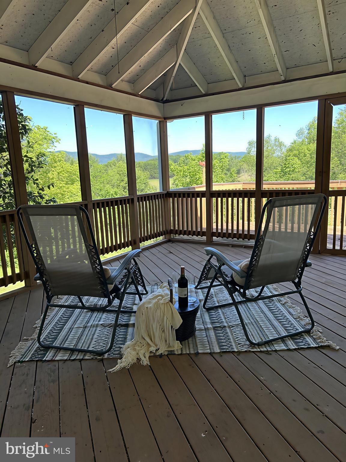 NEW OPPORTUNITY!
Sometimes the right home simply needs the right moment.
Now offered at $575,000, this private mountain retreat presents an exceptional opportunity to own over 5 acres with panoramic mountain views for less than its recent appraised value.
If you've been waiting...this may be your sign.
Imagine ending every day like this...
The drive home slows your heartbeat.
You pull into your private driveway, step onto the porch, and the Blue Ridge Mountains stretch out in every direction.
Peace and quiet.
No neighbors looking in.
Just changing skies, birdsong, and room to breathe.
Inside, nearly 2,600 square feet of one-level living offers four spacious bedrooms, a library filled with natural light, a warm brick fireplace, and windows that make the mountains part of every room.
Outside? That's where this property shines.
A screened porch.
Two decks.
Two sitting porches positioned to enjoy both sunrise and sunset.
Whether you're entertaining family, reading a book, watching summer storms roll across the valley, or simply enjoying your morning coffee, every corner of this property invites you to slow down.
Located just minutes from Front Royal—but feeling a world away—this 5.03-acre property also includes adventure trails, a pole barn, and no HOA (restrictions), and is now offered at $575,000.
Some homes check boxes.
This one changes your pace of life.
This is more than a home—it's an opportunity to create the lifestyle you've been dreaming about. Bring your gardening plans, your chickens, your goats, your hiking boots, and your imagination.
Roof replacement 2019, siding replacement 2020, well pump/pressure tank replaced 2022.
HVAC has 2 propane furnaces w/400 gallon storage tanks (owner owned) plus 2 AC units.  East furnace replaced in 2016 and west furnace replaced 2022.  AC units replaced in 2024.
Whole House generator added 2015. active radon system, Septic pumped 2025.
UV Sterlization unit and filter added to water system 2022.
Pioneer style cooking wood stove in basement.
2025 survey with boundary markers set (This will help save on owner's title insurance).