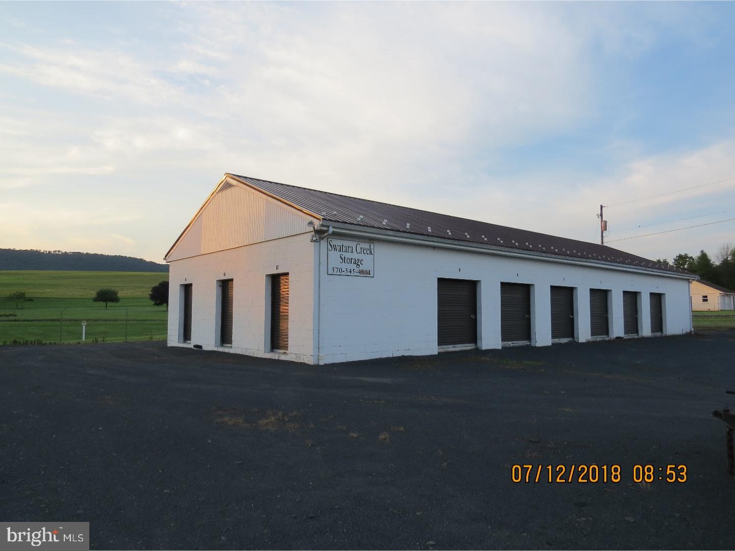 Perfect income producing opportunity with these storage units on a gated lot that is conveniently located!  There are 18 units in varying sizes on over 2 acres including extra parking storage for RV's, trucks, etc.  There are (5) units 10 x 10, (8) units 10 x !5, (2) units 10 x 10, (1) unit 12 x 16, (1) unit 11.5 x 12 and (1) unit 12 x 16. All are currently rented except 2. Also, new metal roof was installed in 2016.