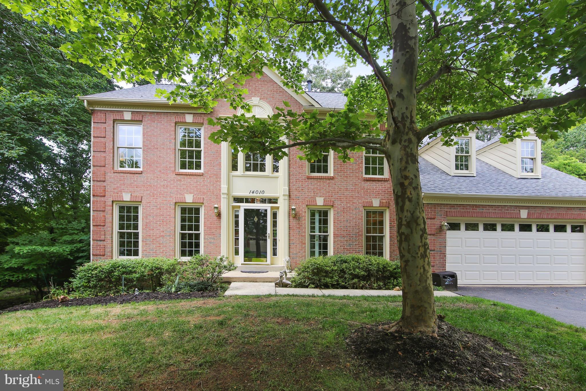 Don't miss this! Three finished levels, stunning brick colonial with two story foyer, first level library/office, formal LR and DR.  Gourmet kitchen that flows to family room with windows galore, private deck backs to woods. Four spacious BR's and two full baths up, new carpet, new MBR skylight.  Walkout basement, light, bright, FB and ample storage. New roof & fresh paint 2018. Two car garage.