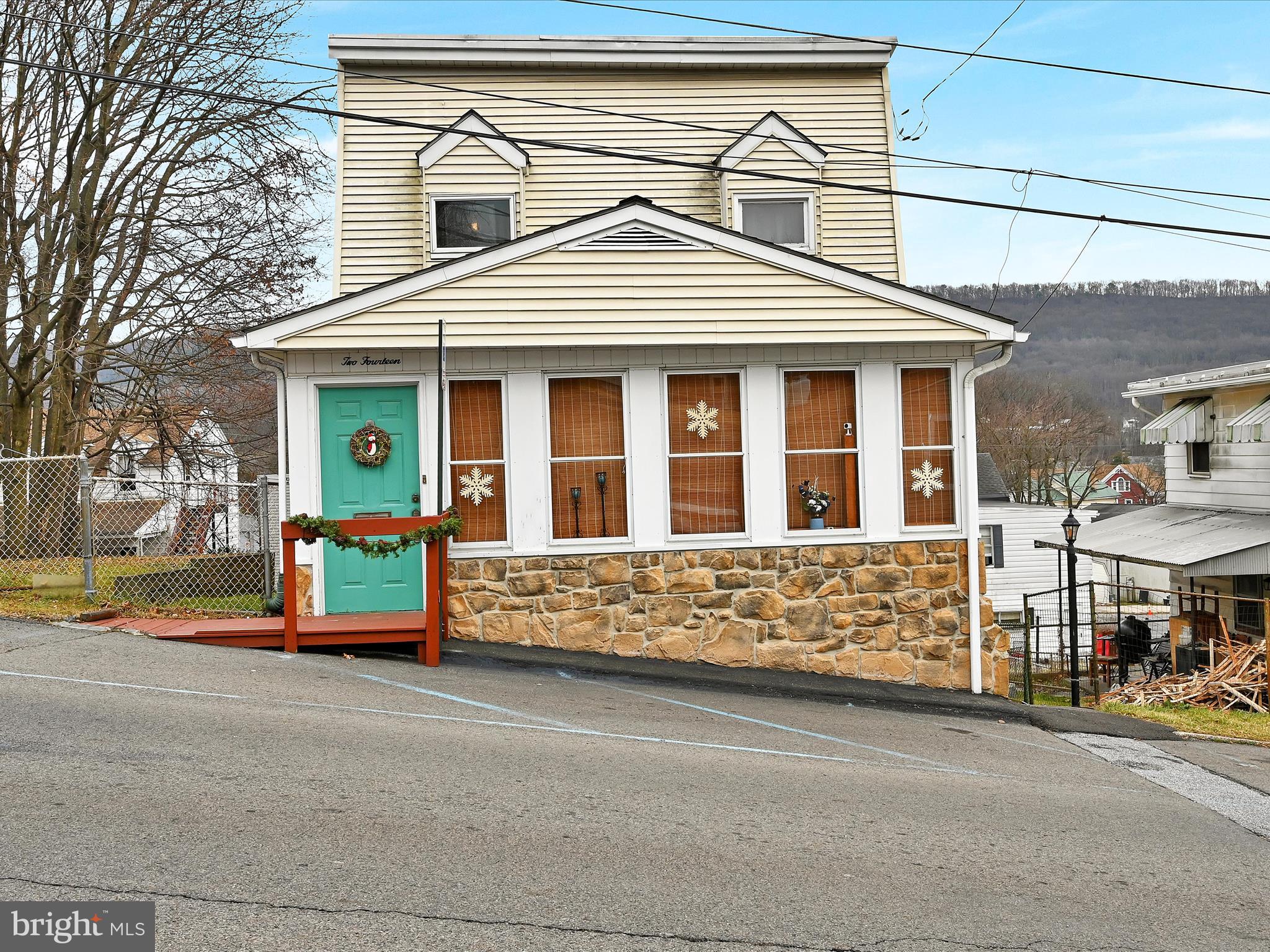 This adorable and affordable Port Carbon home will be a great place to start off 2024! Upon entering, you are greeted by a heated sunroom that is sure to please the green thumb in the family. Its a great place to hang your coat and kick off your shoes before entering the main part of the home as well. You'll love the large living spaces on the main floor. The living room and family rooms both get a ton of natural light and room for everyone to relax.  The spacious eat in kitchen has ample counter and cabinet space and leads to a peaceful and private back yard patio area. The deck and low maintenance back yard provide a great place to enjoy relaxing outdoors in the coming warmer weather. On the 2nd floor there are 2 large bedrooms and a modern full bath with lots of closet space and beautiful tile floors. This home has dual zone oil heat provided by a newer system installed in 2018.  Low taxes and low utility bills make this home even more attractive! Call today for a private showing and lets make this house your home!