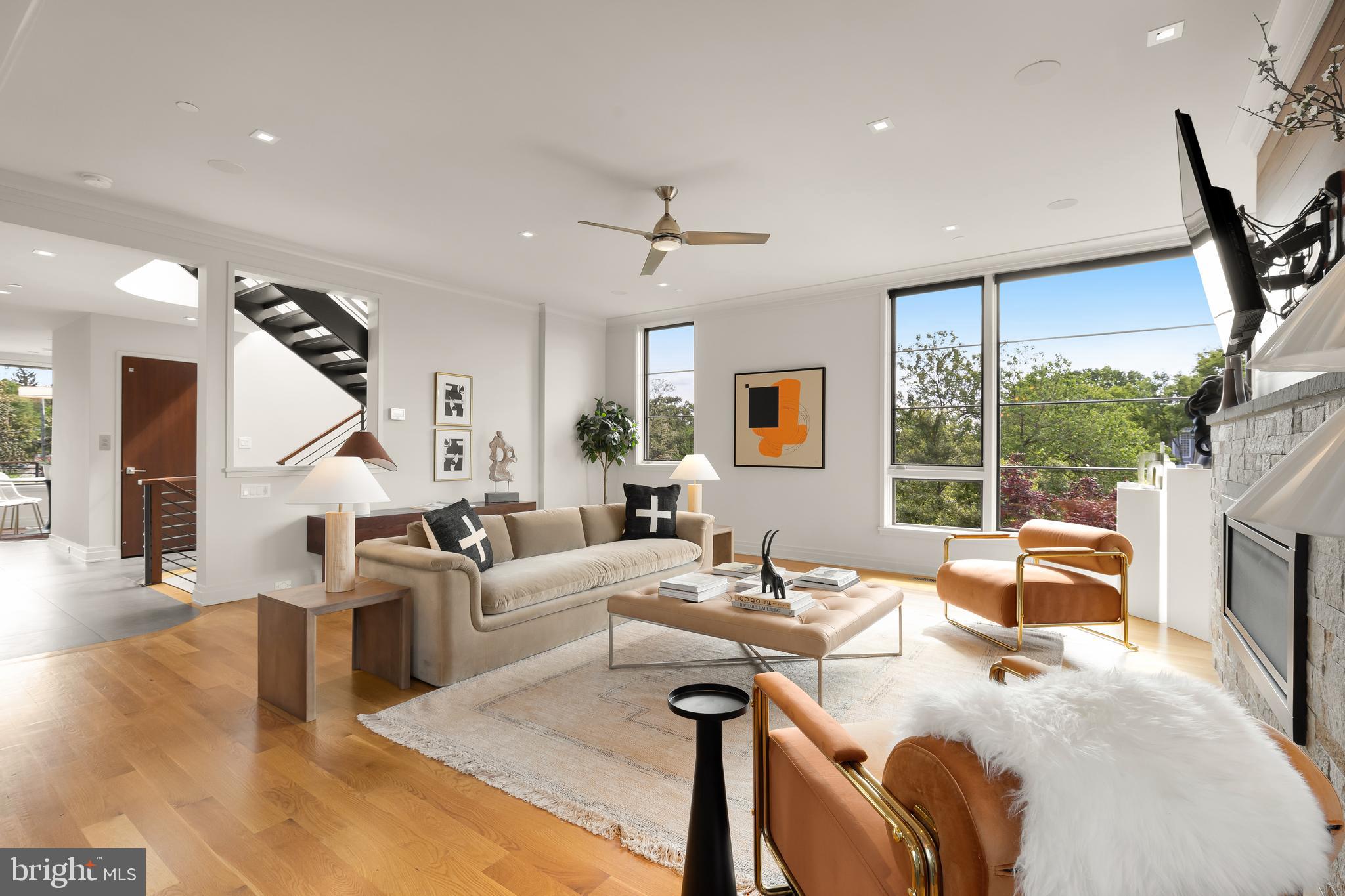 Custom Built Home in the Palisades with River Views | Elevator | Rill Architects | 5 Beds | 4.5 Baths | 4505 Sq Ft | Private Roof Deck | Landscaped Yard | Garage + Driveway Parking.

Situated on a quiet street in the Palisades, this custom-built home offers extraordinarily easy city living with bonus river views. Designed by Rill Architects and constructed with the highest quality materials and finishes, this is an incredible opportunity to become only the second owner of a truly special property.

The home opens with a spacious entry foyer offering immediate views of the outdoors through one of the many large-scale windows found throughout. There is ample wall space for displaying art, along with immediate access to the elevator (servicing all levels) and a dramatic, light-filled stairwell. This level includes three bedrooms and two full baths, all offering a distinct sense of privacy and access to outdoor spaces, including a large deck and the garden.

The next level features a beautiful and tranquil primary suite, complete with a double-vanity bath, a large steam shower, and a generous walk-in closet. This suite is a true retreat, situated in its own wing of the home. Just down the hall, you'll find a laundry room, another bedroom and full bath with a tub/shower combination, and built-in cabinets for linen storage.

Arriving at the kitchen level, you're greeted by more expansive windows offering treetop and river views. The chef’s kitchen includes island seating, a six-burner cooktop, a Sub-Zero refrigerator, wood cabinetry, and striking countertops. The dining and living spaces are expansive and open to the kitchen, offering effortless flow for everyday living or entertaining. The breakfast room overlooks another outdoor space—perfect for stepping outside with a glass of wine or enjoying a quiet moment in nature. A large pantry and a powder room complete this level.

Not to be missed is the roof deck, offering some of the best views of the Potomac and surrounding treetops that one can enjoy from the comfort of home—ideal for both relaxed lounging and large-scale entertaining. The two-car garage is located on the lowest level of the home, with a driveway that accommodates multiple vehicles. Access all levels easily via stairs or the elevator.

Just a short drive to Georgetown or the neighborhood shops and restaurants in the Palisades, with quick access to Virginia and downtown, this location offers the best of easy, contemporary city living.