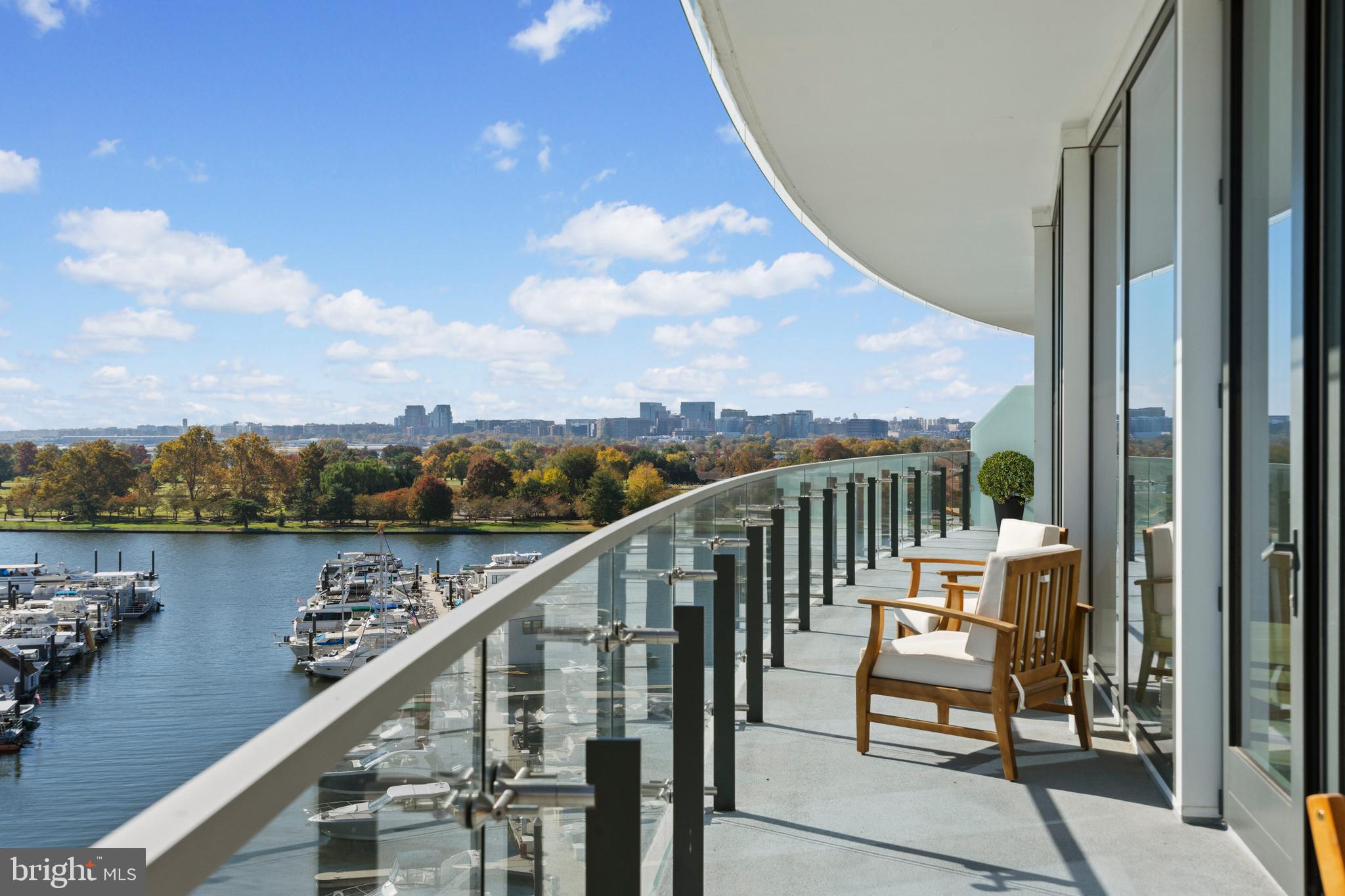 Welcome to 601 Wharf St SW #702, located in the Amaris condominium, designed by award winning architect Rafael Viñoly. This stunning 3 bedroom, 3.5 bath, 2,100+ SF condo offers elegant living and bespoke finishes in the heart of the Wharf. Upon entering through the private elevator, the open concept living and dining rooms feature floor to ceiling windows, automated shades, and wide plank french oak hardwood floors, plus access to the expansive 51ft long terrace with breathtaking views of the Wharf and Potomac River. The adjacent chef’s kitchen is outfitted with Stevali Italian cabinetry, top-of-the-line appliances, and marble countertops which makes it equipped for hosting events large and small. The spacious primary suite is well-appointed with terrace access, ample closet space with custom built-ins, and a luxurious spa-like bathroom. Down the hall, a generously sized second bedroom with ensuite bath is accompanied by a third bedroom and guest bath. Two parking spaces & Storage unit completes this exceptional offering.  The unit can be sold fully furnished. Amaris provides its residents many wonderful amenities including concierge, valet, pool + sauna, building gym, community lounge, and rooftop with grills. Conveniently located at the Wharf, steps to numerous restaurants, shopping, and nightlife.