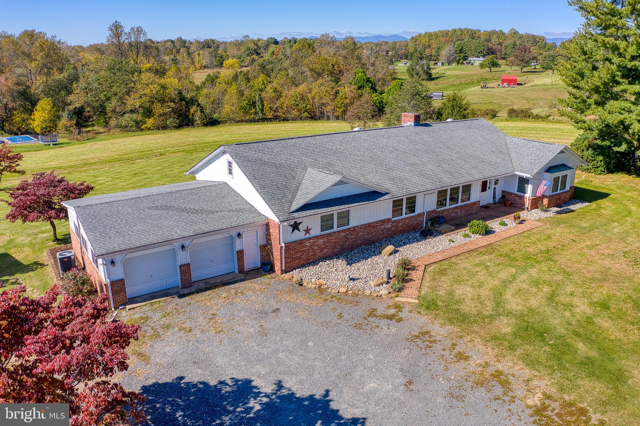 Custom-Built Gem with Modern Updates on Scenic 8.5 Acres Near Culpeper

Discover this meticulously crafted, spacious single-level home just outside Culpeper, with the ideal balance of privacy and convenience on Rt 29. Enjoy generously oversized rooms, timeless chair rail and crown moldings, and thoughtful upgrades throughout.

Welcoming and Expansive Living Spaces: The bright, inviting living room is perfect for gatherings, while the family room off the kitchen features gleaming hardwood floors and a cozy wood-burning fireplace—perfect for relaxing evenings. The expansive eat-in kitchen offers abundant cabinetry, a breakfast bar, and a charming nook, giving you all the counter space and storage you need for cooking and entertaining.

Elegant Dining and Primary Suites: Host holidays in the huge dining/sitting area, perfectly designed for entertaining. The primary suite is a retreat with a walk-in closet and private full bath. A second primary suite offers extra luxury, with custom built-ins, two closets, a custom headboard, and a beautifully renovated ensuite bathroom.

Versatile and Abundant Storage: A separate staircase leads to a spacious loft, and a walk-in attic provides extensive storage options. The oversized third bedroom also has built-in storage and shares access to a fully renovated bathroom featuring a ceramic tile walk-in shower.

Expansive Lower Level and Outdoor Living: The enormous finished walk-out basement includes a cozy wood-burning fireplace, luxury vinyl plank flooring, a wet bar for entertaining, and abundant natural light. The enclosed sun porch spans the length of the house, offering a serene space to enjoy your peaceful surroundings.

Country Living at Its Best: No HOA, bring your animals! With a fully fenced yard, 2 large pastures, 3 smaller pastures, a chicken coop, run-in shed, and a detached workshop perfect for tractor storage, this property is well-equipped for your country lifestyle. High-speed Comcast internet is available.

This property offers a rare combination of spacious, one-level living with unlimited potential for enjoying the best of country life. Make it yours and start creating your dream rural retreat today!