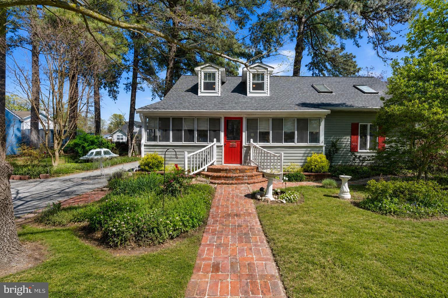 Perfectly positioned in the heart of Rose Haven, this rarely available Cape Cod, offers more than just a home, it offers a lifestyle centered around the water.

Located just steps from Herrington Harbour, you’ll enjoy beautiful harbor views and the everyday luxury of coastal living, where the sights and sounds of the water become part of your daily rhythm.

Whether it’s sipping your morning coffee while watching boats pass, enjoying gentle bay breezes, or taking in vibrant sunsets over the harbor, this home delivers a truly special connection to its surroundings. It’s a setting that naturally encourages a relaxed pace and a genuinely happy, water-oriented way of life.

Thoughtfully maintained, featuring a new roof, windows, and siding, providing peace of mind and timeless curb appeal. Take in harbor views from the front yard. Inside, and step inside to find a warm and inviting interior anchored by a cozy gas fireplace, perfect for year-round comfort, along with a tankless water heater for modern efficiency.

The standout sun-filled addition impresses with soaring vaulted ceilings and a striking spiral staircase leading to a versatile loft, ideal for a home office, reading nook, or creative retreat, all enhanced by natural light.

Craftsmanship shines throughout, making this home a true showcase for anyone who appreciates fine woodworking. Custom details include handcrafted kitchen cabinetry, hand made doors, a built-in executive desk with bookcases, shelving, trim, handmade staircase detail, and rich wood flooring, all meticulously designed and executed.

Step outside to a spacious deck designed to take full advantage of the coastal atmosphere, perfect for entertaining, relaxing, or unwinding in the new 2023 hot tub under the open sky. The backyard also features a large dedicated woodshop, offering endless possibilities for hobbyists or artisans.

Living in Rose Haven means fully embracing a waterfront lifestyle. With Herrington Harbour just steps away, you’ll have easy access to waterfront dining, and scenic shoreline enjoyment.

Residents can choose to have the opportunity to join the Herrington Harbour pool, adding another layer of enjoyment for warm summer days spent poolside with family and friends.

This is a rare opportunity to own a home where exceptional craftsmanship, comfort, and sweeping harbor views come together to create an unparalleled coastal living experience.