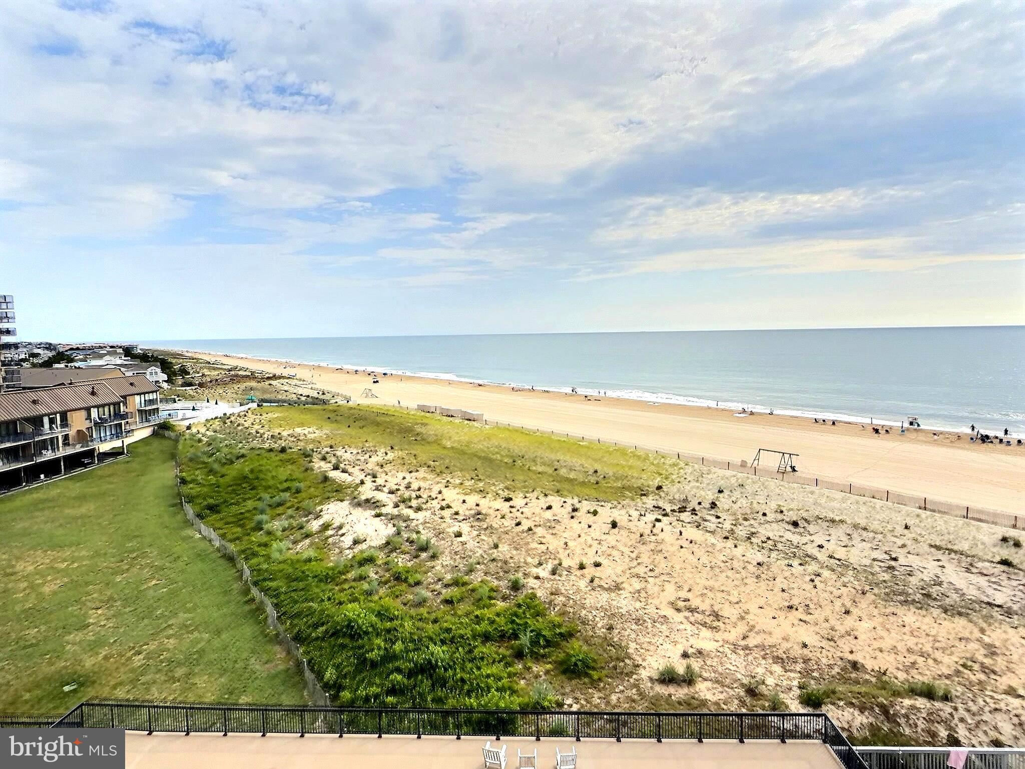 First Time Ever on the Market! Lovingly maintained by the original owners, this exceptional 6th-floor oceanfront condominium is being offered for sale for the very first time. Cherished for many years and never rented, this is a rare opportunity to own one of Sea Colony's most desirable residences.
Perfectly positioned on the point section of the building and closest to the ocean, this spacious condominium features a wraparound balcony that captures some of the most magnificent panoramic views in all of Sea Colony.  Enjoy unforgettable sunrises over the ocean, relax to the soothing sounds of the waves and enjoy front row seats to Bethany Beach's annual Fourth of July Fireworks.  Whether you're sipping your morning coffee, enjoying an evening cocktail, or simply taking in the fresh ocean breeze from the expansive balcony, you'll appreciate the unparalleled beauty that surrounds this remarkable property.
Designed to maximize both comfort and the spectacular scenery, the open living and dining areas are enhanced by custom overhead track lighting and motorized window shades, creating a warm and inviting atmosphere. Large glass sliders fill the home with natural light while framing the endless ocean views.
The kitchen features a generous amount of cabinetry, and a functional layout perfect for entertaining family and friends. The washer and dryer have been thoughtfully relocated from the kitchen to a convenient hallway closet, creating additional kitchen workspace.
The home is being sold fully furnished with superior furnishings that have been lovingly maintained over the years. The newly renovated primary bathroom offers a spa-like retreat with a stunning walk-in shower featuring pebble stone flooring and elegant finishes.
Sea Colony offers an unmatched resort lifestyle with a half mile of private guarded beach, multiple indoor and outdoor swimming pools, state-of-the-art fitness centers, championship tennis facilities, walking and biking paths, beautifully landscaped grounds, pickleball courts and 24-hour security. All this plus just moments from Bethany Beach's charming shops, restaurants, and boardwalk,
This is more than a condominium—it's a once-in-a-generation opportunity to own a home that has been treasured by its original owners and is now ready to create memories for its next fortunate owner.