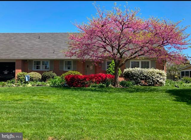 ***First American One Year WARRANTY INCLUDED - Paid for by Seller*** 

This beautiful home is located in the highly sought-after neighborhood of Spring Valley with no HOA, offering easy access to amenities and Interstate 81, while being in a quiet secluded feeling neighborhood. 

The property is impeccably landscaped, enhancing its curb appeal, and amazing in full bloom!
Inside, you will find kitchen and bathrooms that have been recently renovated, including granite countertops, stylish backsplashes, and new flooring, giving the home a modern and elegant feel but the quality everyone desires.  All other areas have the original hardwood floors throughout that still shine!

The fenced yard provides privacy and space for outdoor activities featuring a patio and screened porch. Perfect for entertaining and enjoying the outdoors.
The home features 5 generously sized bedrooms, with two particularly large ones that could both serve as primary bedrooms. On the main level - 2 bedrooms - one primary and one that could serve as an office with large built in bookshelves, that would be perfect for someone that works from home with a great backyard view! 
The upper level boasts three additional bedrooms, including the additional optional primary bedroom with a large walk in closet. 
The unfinished basement offers great storage with the potential to make it whatever you want.   Storage space throughout the home is outstanding, with spacious closets and surprising storage solutions at every turn. The laundry room has the benefits of being on the main level.  The home also includes a two-car garage with an attached workshop, perfect for any projects and extra storage. 
This is a perfect property for those looking for comfort, style, and convenience in a prime location. 
This charming home also features a cozy wood-burning brick fireplace with the option to convert to propane if desired (insert included)  perfect for those cold evenings. 
security cameras on site