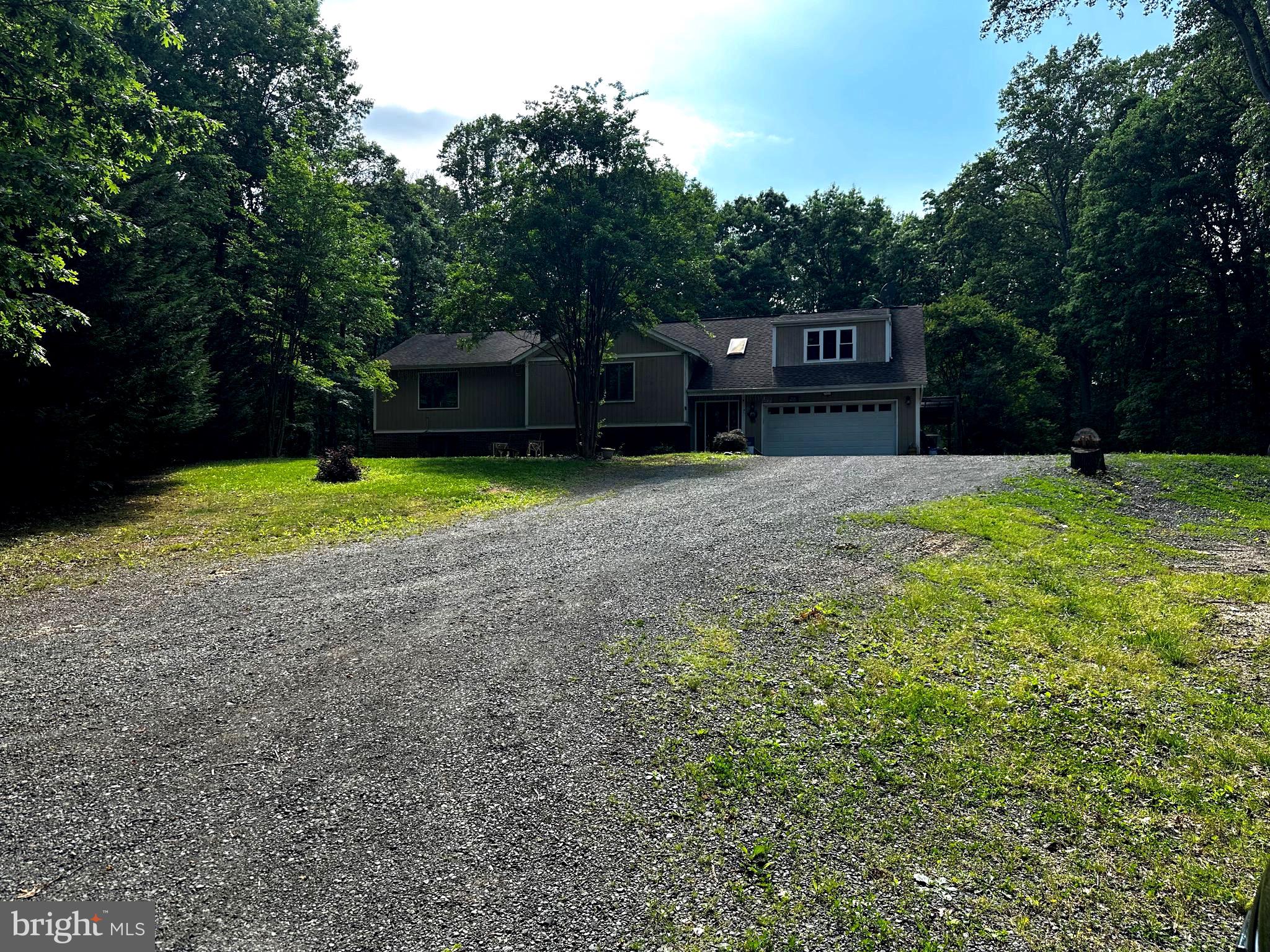 NO HOA!!!!

Beautifully secluded home on 4.01 acres, Large open floor plan with two stories. Two pellet stoves to extra heat in the winter. Formal living and dining room on main level with an amazing sunroom that opens to a deck and overlooks the inground pool. Basement is finished with wet bar, den, pool room, and bedroom. Big two car garage with finished walls and wired for 220. Master suite with his and her dressing rooms. Video cameras are not active. Sold in as is condition. Any inspections are for buyers' information only. 
Any reasonable offer will be accepted.
Schedule showings through Showtime,  Sentrilock box at front door