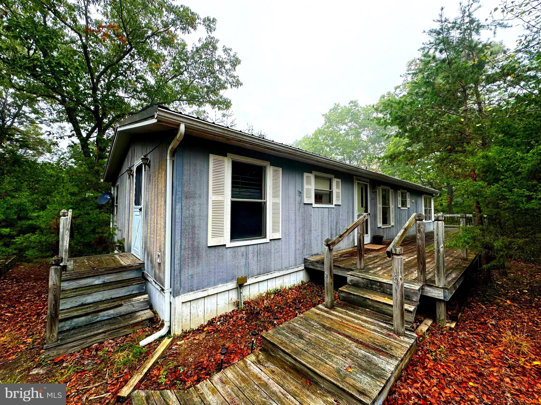If you are looking for seclusion and privacy look no further! This home is nestled away in its own pine thicket. With over 2 acres of property for exploring you have plenty of room. Inside there are laminate floors through out with over sized windows for all the natural light! A private primary bedroom and bath will leave you feeling like the king or queen of this castle.