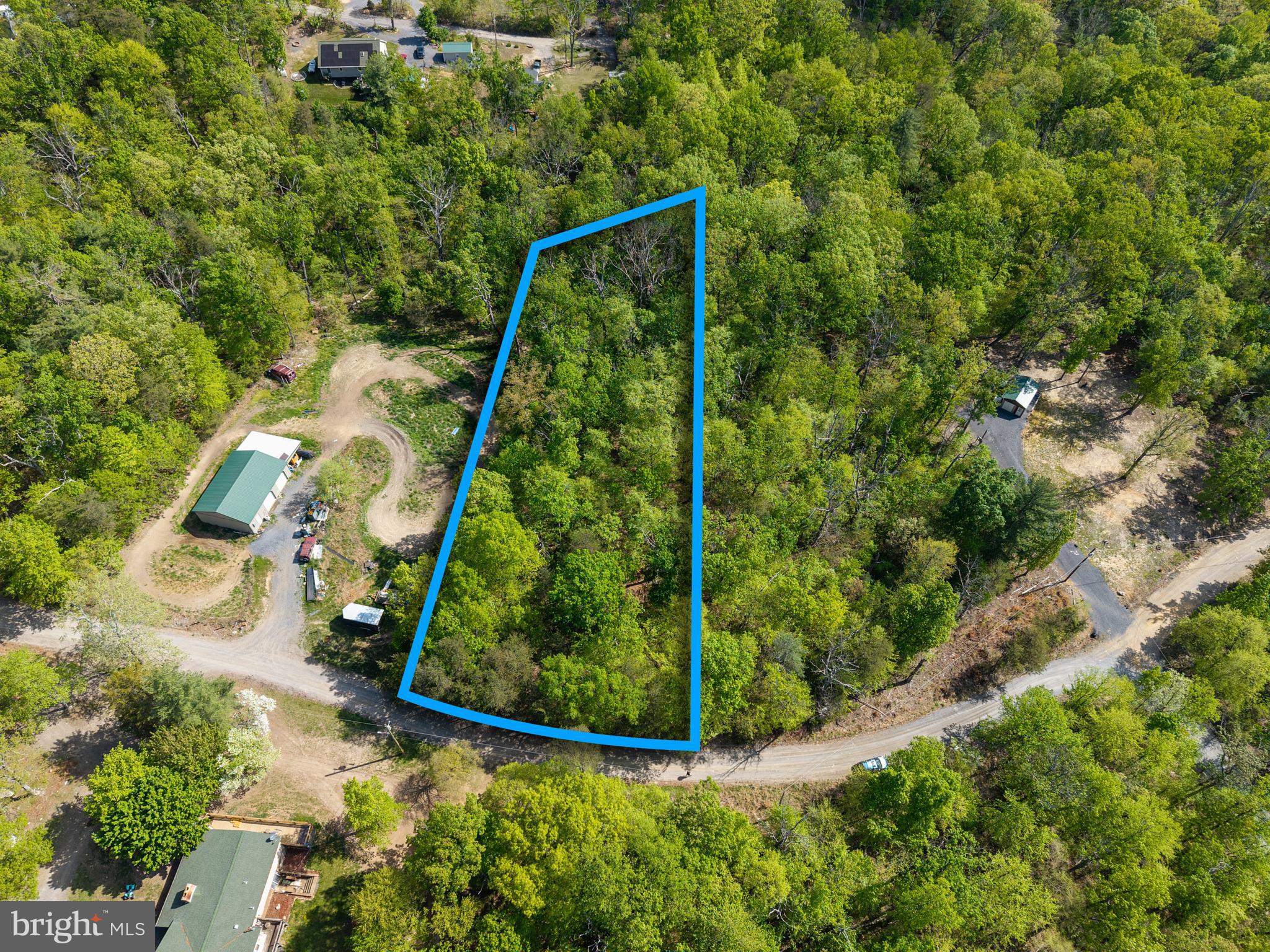 Excellent opportunity to own a wooded building lot in Shenandoah Forest Subdivision on the Massanutten Mountain just outside of Luray, Virginia. Whether you are looking for a future mountain getaway, short-term rental investment, cabin site, or location for a second home, this property offers outstanding potential in one of Page County’s most popular mountain communities. A one bedroom septic certification letter is already on file (no septic system is currently installed), helping streamline the building process. The property also features a recent survey with corners marked by a licensed surveyor, electric nearby for convenient connection, and access via a well-maintained HOA gravel road. Surrounded by natural beauty and outdoor recreation, the property is located near the Shenandoah River, Shenandoah National Park, hiking trails, fishing, kayaking, and all the attractions of the Shenandoah Valley. Short-term rentals are allowed, making this an ideal opportunity for investors seeking vacation rental income potential. Enjoy privacy, mountain living, and investment flexibility while still being just a short drive from the Town of Luray, shopping, dining, and local attractions. Bring your cabin plans and start building your mountain retreat today.