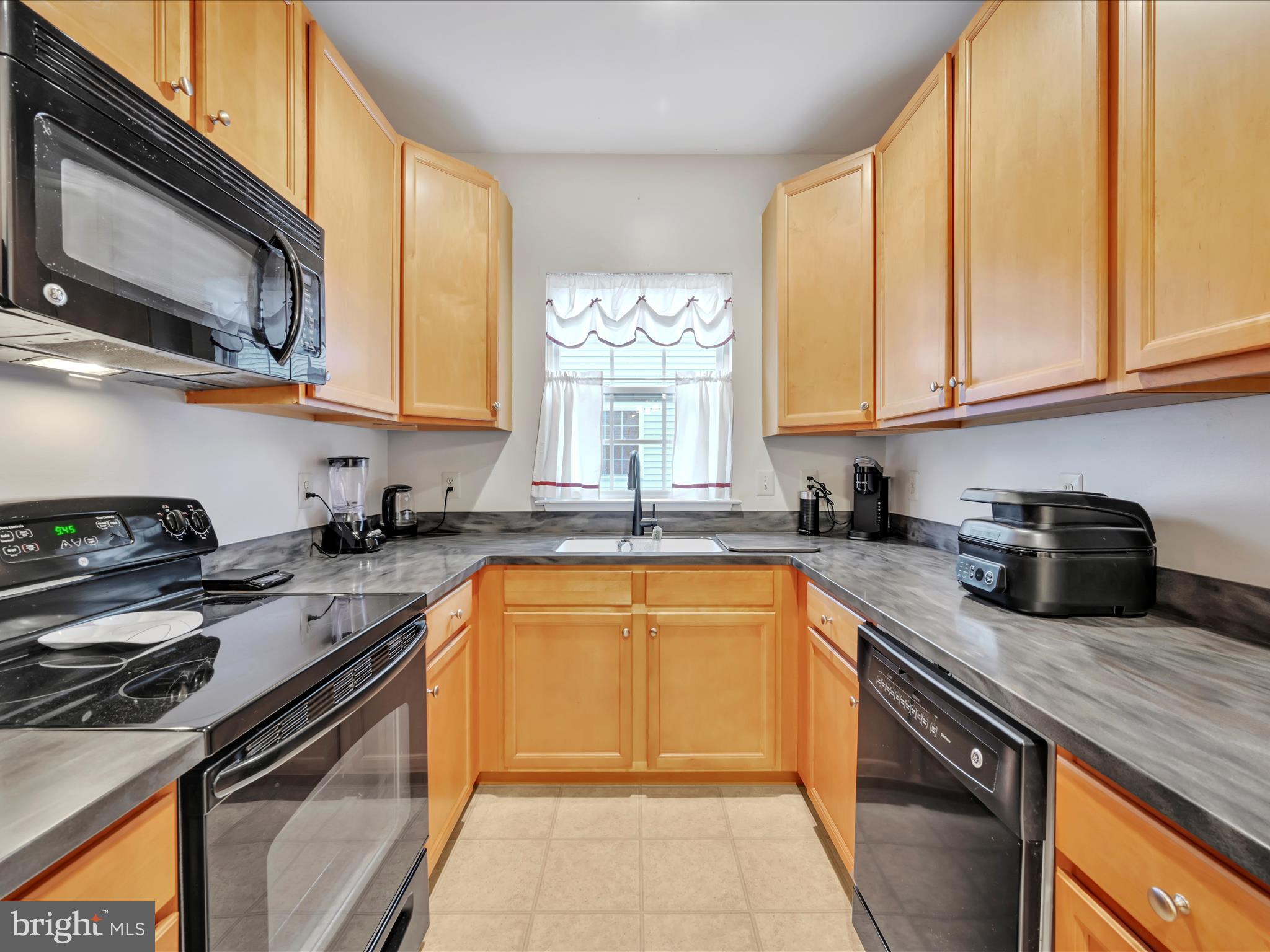 This lofty townhome backs right up to the trail... Ahuge upper loft which could serve as a great office, guest quarters, a 3rd bedroom area. The 2 baths have Quartz counter tops, the kitchen Corian.... This home is one of tgge ones with a garage space all-your-own for storage and car. Beatiful kitchen cabinets appear to be maple wood.A convienent to get to laundry room. Sit out summer night on your private balcony watching the trail goers! Take this home off the market....Monthly association fee, according to Seller, covers common area maintenance, landscaping, snow and trash removal. Buyer $600 one-time contribution fee to association according to Seller. All smoke detectors replaced within about 2 years ago  according to Seller, inside and out, including heater shed on balcony. 3rd bedroom reference is the upstirs loft if you add a closet...