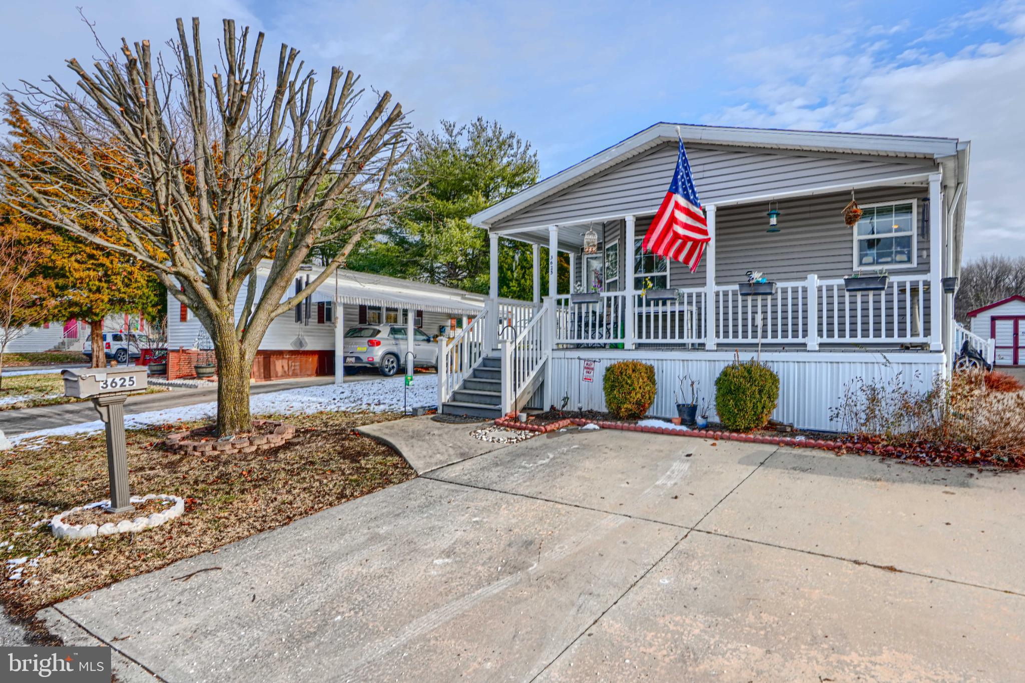 Welcome to Williams Estates in Middle River.! This three bedroom, two bath home has the perfect blend of comfort, convenience, and affordability. Relax on the cozy covered front porch on warm summer nights. Entertaining is easy in this open concept living room/dining room. The eat-in kitchen includes stainless steel appliances, lots of counter space with tons of storage The large primary bedroom boasts a walk-in closet and an en suite which includes a double sink and shower. Two other bedrooms share a hall bath. A laundry room with full size washer and dryer leads to side entrance with an outdoor shed. Neutral colors throughout. NEW HVAC installed.The community includes a playground, dog park, fitness center and more. Conveniently located to I-95 and I-695 makes travel quick to work, recreation and local attractions. All buyers must be park approved. Ground rent is currently $1120 a month.