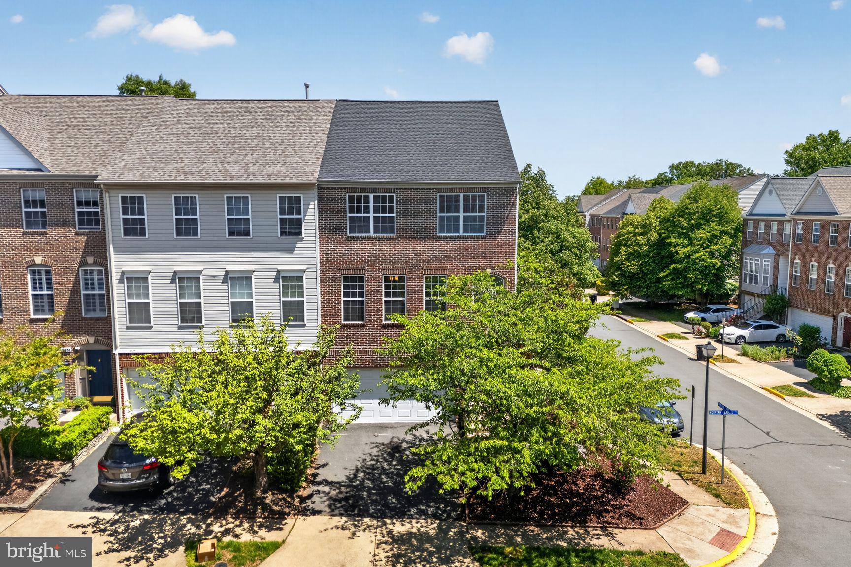 Stunning end-unit brick-front townhome in the highly desirable Westerly community of Sterling, offering modern updates, abundant natural light, and exceptional convenience.

Freshly painted throughout (May 2026), this beautifully maintained three-level home features an open and inviting floor plan with 3 bedrooms, 3 full baths, and a 2-car garage. Sunlight pours through expansive windows, enhancing the bright and airy feel across all levels.

The entry opens to a dramatic two-story foyer leading to a spacious lower-level recreation room with LVP flooring and a full bath—perfect for guests, a home office, or additional living space. Walk out to a fully fenced patio ideal for outdoor enjoyment.

The main level is designed for effortless living and entertaining, showcasing durable LVP flooring and a seamless flow between the living, dining, and kitchen areas. The gourmet kitchen is appointed with granite countertops, a center island, white cabinetry, and stainless steel appliances, including a newer dishwasher (April 2026). Step out from the family room to a generously sized deck—perfect for relaxing or entertaining.

Upstairs, you’ll find three well-proportioned bedrooms with vaulted ceilings, including a spacious primary suite featuring a walk-in closet and an en-suite bath with a soaking tub and separate shower. The laundry area is conveniently located on the bedroom level, with a brand-new washer and dryer to be installed.

Major updates include: Roof (2022), HVAC (2020), Water Heater (2020), Kitchen Appliances (2021), LVP Flooring (2025), Fresh Paint (2026), Updated Lighting, and Brand New Washer (2026) and Dryer (2026) and New Blinds (2026).

Recent maintenance updates include professionally cleaned HVAC ductwork and dryer vent, contributing to efficient system performance and enhanced indoor comfort.

Ideally located just minutes from major commuter routes, shopping, dining, parks, and Dulles Airport, with easy access to community amenities including a tot lot.

A perfect combination of style, space, and location—this home is truly move-in ready. Don’t miss this exceptional opportunity.