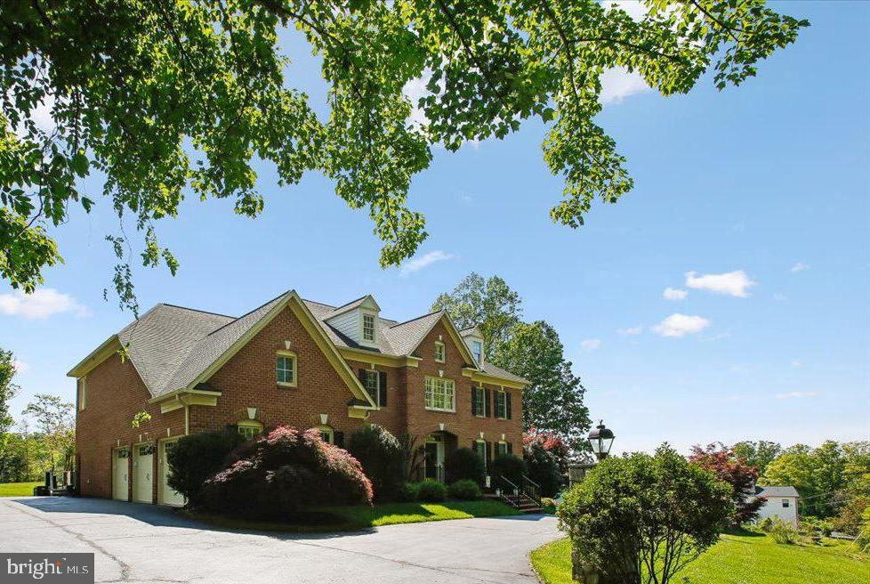 OPEN SATURDAY, JUNE 6, 1 PM TO 3 PM. LUXURY LIVING AT A SUPER CONVENIENT LOCATION, JUST 10-15 MINUTES FROM VIENNA METRO AND I-66!  Experience a more refined way of life and entertain in style in this light-infused Renaissance Grand Monet model, a masterpiece spanning 8,600 square feet within the coveted Oakton Crossing community. Recently refreshed with up-to-the-minute 2025 and 2026 upgrades, the home welcomes you with an impressive two-story foyer and 7.5" wide-plank wood flooring that flows throughout the main and upper levels. The open-concept main level is designed for sophisticated entertaining and comfortable living, featuring a two-story great room with floor-to-ceiling Palladian windows and a gourmet kitchen equipped with granite countertops, cherry cabinetry, and a large center island. This level seamlessly transitions from formal dining and living areas to a private office and a versatile sunroom with its own balcony. The breakfast room opens to an expansive deck with a pergola, perfect for indoor-outdoor living on the lush 0.88-acre lot.  The luxury continues upstairs... The upper level serves as a private sanctuary, anchored by an expansive owner’s suite featuring a fireplace-warmed sitting room, a spa-like ensuite bath, and massive walk-in closets. Three additional spacious bedrooms complete this floor, including one with an ensuite bath and a Jack and Jill configuration serving the other two bedrooms....  For multi-generational living, the walk-out lower level offers a massive recreation room with full bath, a gym, bonus room, and a dedicated au pair or in-law suite with its own full bath. ...  Outside, the brick-wrapped exterior is complemented by a circular drive and a three-car garage. The driveway has been expanded in areas for additional parking. The rear yard has room for a pool and play equipment.  Situated within the prestigious Oakton school pyramid and minutes from shopping and dining, this meticulously maintained residence perfectly balances grand architectural detail with modern convenience. Updates/replacements as follows: completely remodeled half bath on main level, added built-ins and surround sound speakers to living room - 2026. Interior repainted, added carpet runners to main level stairs, added recessed lighting to living room, upgraded foyer light fixture, replaced all kitchen appliances, replaced garage doors along with door openers and remote entry devices, 3 HVAC systems replaced - 2025.  Full bath added and au pair/in-law suite created in lower level, water heater replaced, washer replaced, driveway parking expanded and driveway paved, brick driveway aprons added, invisible dog fence added - 2024. Wood flooring added to main and upper levels, primary bath shower door and bath fixtures replaced - 2023.