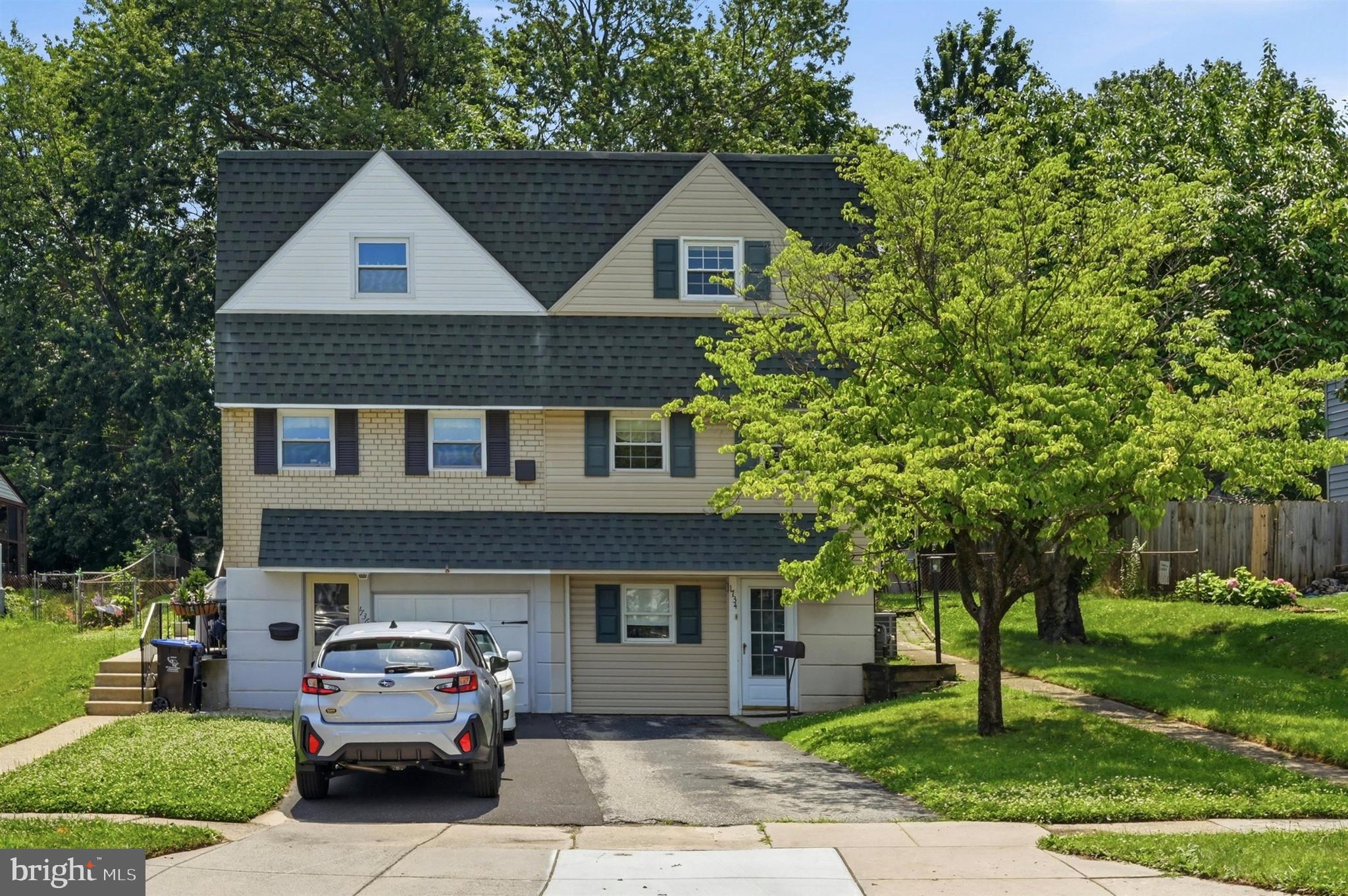 Welcome to this beautifully maintained 3-bedroom twin home in Norristown, offering approximately 1,630 square feet of thoughtfully designed living space, quality updates, and exceptional versatility. Expanded with a spacious 450-square-foot addition, this move-in ready home blends timeless character with modern improvements and a functional, open layout.

From the moment you arrive, you'll appreciate the attractive curb appeal, featuring newer vinyl siding, a newer chimney, replacement double-hung windows, and an updated kitchen, all completed approximately six years ago. An attached one-car garage, private driveway, and mature landscaping complete the exterior.

Inside, luxury vinyl plank flooring flows throughout much of the main level, creating a warm and inviting atmosphere. The spacious living and dining areas open into the impressive 450-square-foot addition, where vaulted ceilings, abundant natural light, and a decorative fireplace provide the perfect space for entertaining or everyday living.

The updated kitchen offers abundant cabinetry, generous counter space, modern appliances, and an efficient layout designed for both cooking and gathering.

Upstairs, you'll find three generously sized bedrooms, each featuring cedar-lined closets for added charm and storage. A full hall bathroom serves the upper level, while a conveniently located half bath on the main level adds everyday functionality.

The finished lower level adds valuable living space with a recreation room featuring a custom-built bar, making it ideal for game days, movie nights, or hosting family and friends. A dedicated laundry area and additional storage complete this level.

Outside, enjoy a private backyard with a patio perfect for outdoor dining and entertaining, along with a storage shed for tools and seasonal items. Mature trees provide shade and a peaceful setting.

With its expanded living space, thoughtful updates, and inviting indoor and outdoor living areas, this home offers comfort, functionality, and plenty of room to enjoy for years to come. Conveniently located near shopping, dining, parks, schools, and major commuter routes, it's ready to welcome its next owner.