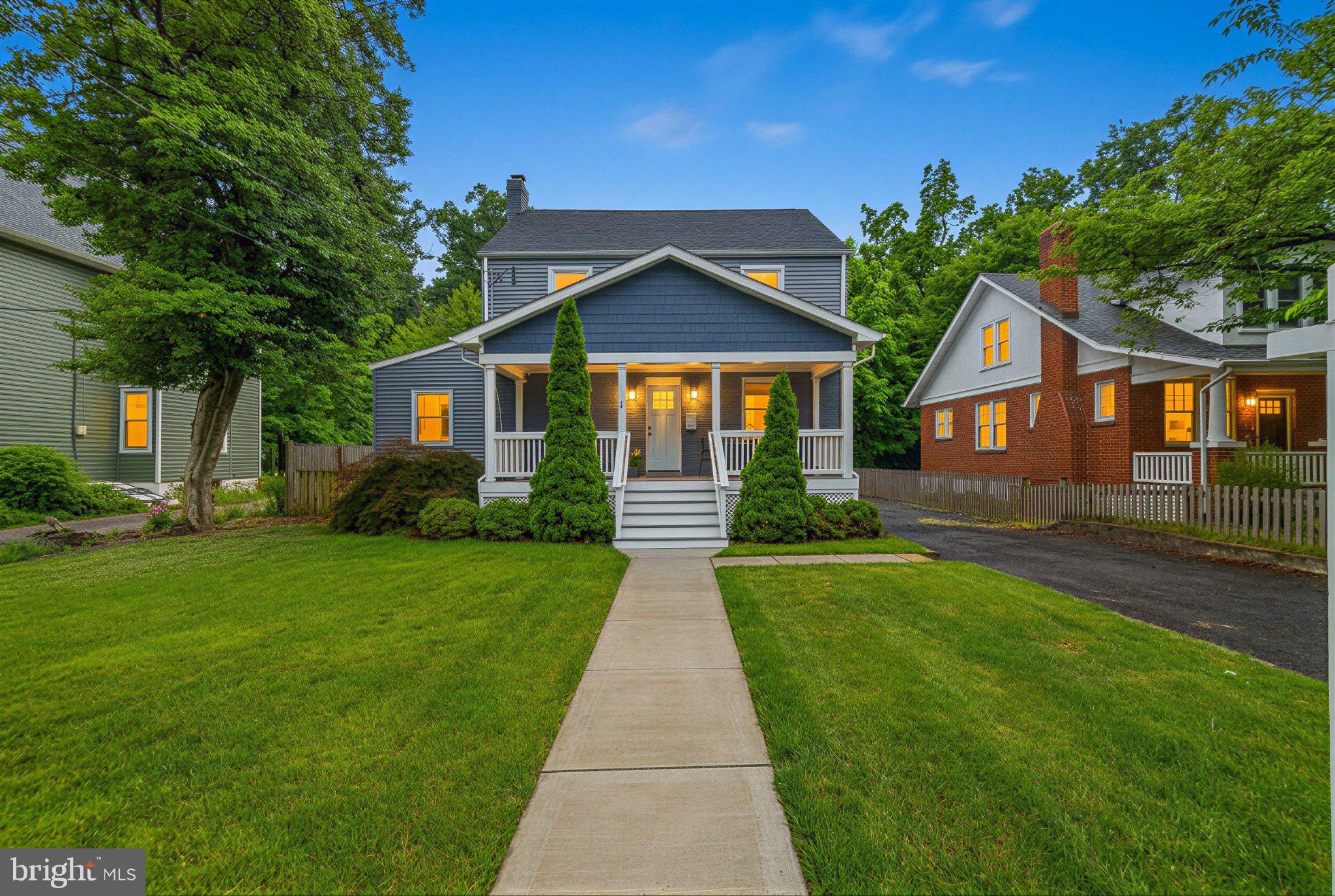 4107 Queensbury Road brings park-side living, effortless entertaining, and everyday convenience together in one unforgettable Hyattsville home.

Step from the cozy screened porch to the new patio and hot tub pad, with Dietz Park just beyond — a local hidden gem that feels like a natural extension of the backyard because you literally open the back gate into the quiet park! 1.5 acres that feels like it's all yours, except you don't have to pay taxes on it or maintain it!
Inside, the home is equally inviting. Fully renovated in 2017, it features a generous entertaining kitchen with quartzite countertops, professional grade Frigidaire appliances, including an induction stove, and a custom pantry added by the current owners. The dining area offers room to gather, while the working wood fireplace with gorgeous custom surround and screened doors brings warmth and character to the main living space. The main-level sunroom adds even more flexibility, functioning beautifully as a dual office, reading room, or quiet retreat.

With four bedrooms and three updated full baths, the home offers smart, flexible living across multiple levels. The primary suite features a marble-tiled bath with a spacious walk-in shower. The walkout lower level includes a bedroom suite with full bath, ideal for guests, an au pair, or additional living space.

Practical updates and everyday conveniences make the home as functional as it is charming, including two HVAC systems and an on-demand hot water heater added in 2022. A detached garage adds storage and parking, while the driveway can accommodate five to six cars. Beautiful landscaping enhances the setting, creating a private, green retreat that’s ready for quiet mornings, easy evenings, and gatherings that spill outdoors.

The location delivers the best of Route 1 living: just half a mile to Hyattsville Crossing Metro, with Vigilante Coffee, the Riverdale Park Farmers Market, the Trolley Trail, shops, dining, and neighborhood amenities all nearby.

Park life, hosting life, commuter life — 4107 Queensbury Road makes room for all of it.