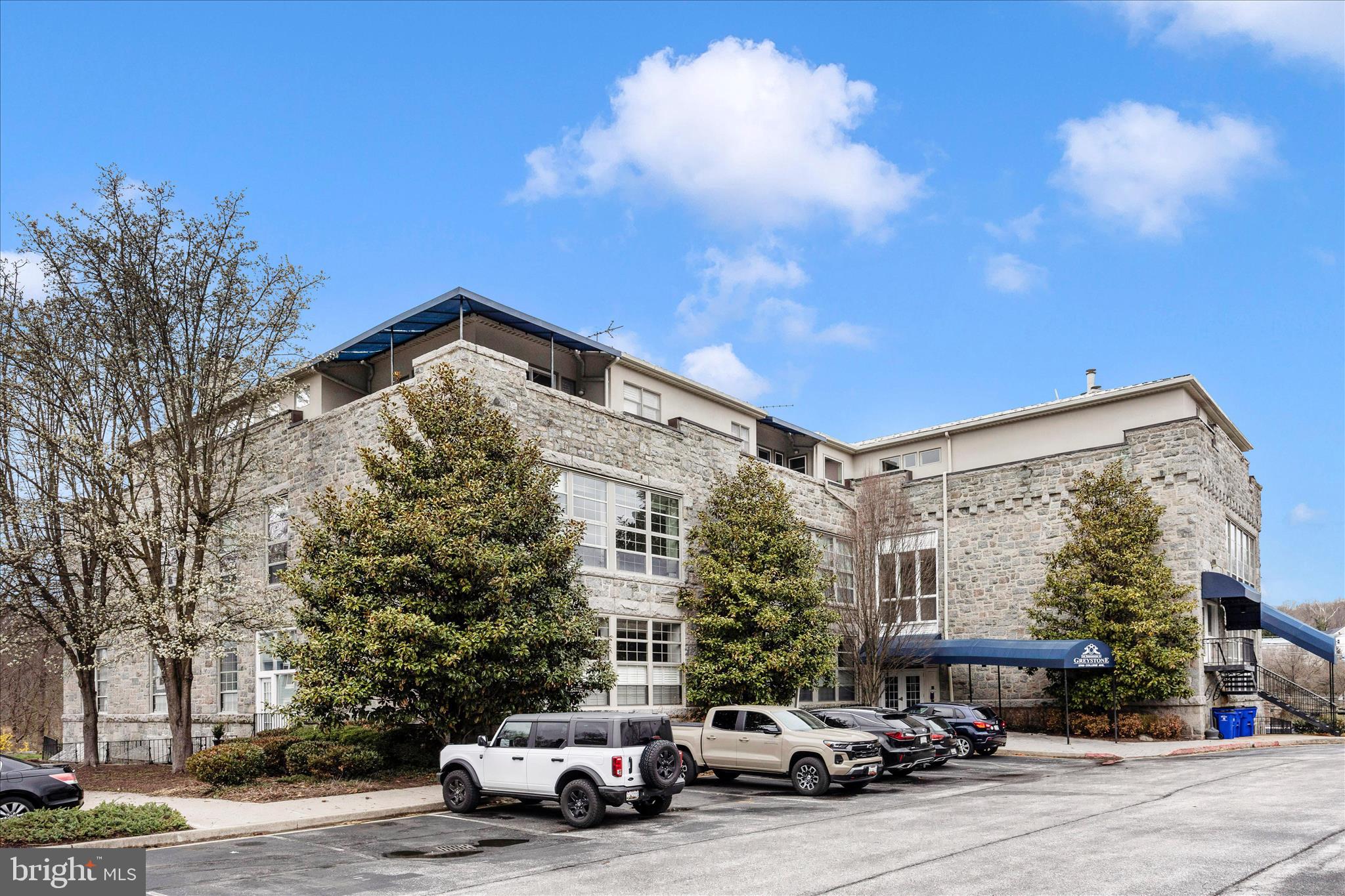 Modern industrial style meets cozy charm in this distinctive Historic Ellicott City condo. 
High ceilings, oversized paneled windows, and abundant natural light showcase treetop and cathedral views. The open-concept living area features a gas fireplace and striking architectural details, while the sleek kitchen is perfect for entertaining or quiet nights in. A spacious primary suite, a second bedroom and half bath provide flexibility for guests, a home office, or additional living space. 
New roof and NEW HVAC unit is getting installed
Just steps from Main Street shops, restaurants, the Farmer’s Market, Trolley Trail, and local festivals, this home blends historic character with modern convenience.