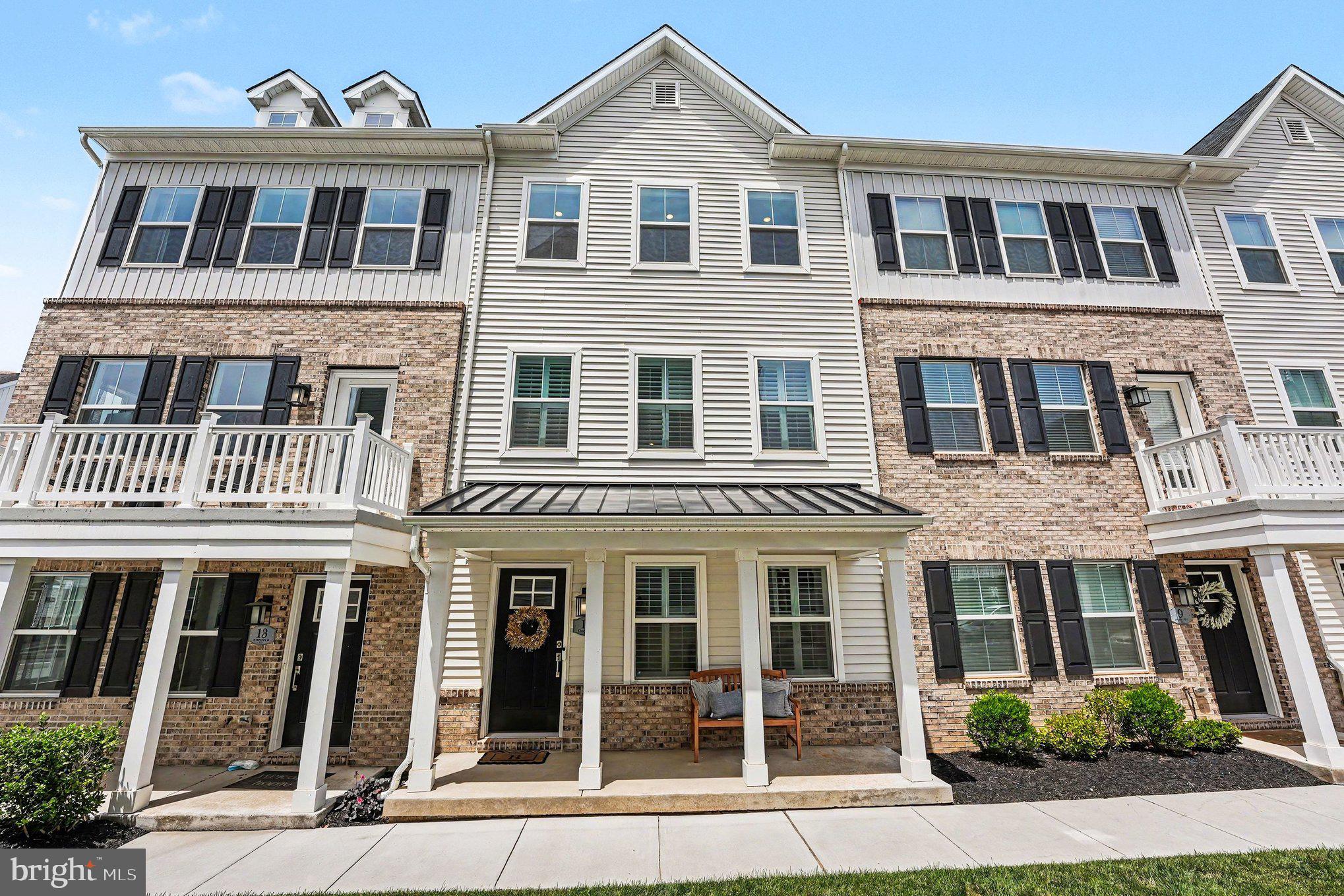 Welcome to 11 Karpovich Alley, a beautifully appointed four-level townhome in the desirable River Pointe community of Bridgeport. Built in 2023 and meticulously maintained, this residence offers the appeal of new construction without the wait, featuring timeless finishes, versatile living spaces, and a thoughtfully designed floor plan that adapts to today's lifestyle.

Upon entry, you'll find a flexible bonus room currently serving as a home office, easily suited for a media room, fitness studio, playroom, or additional living space. A powder room and direct access to the attached two-car garage provide everyday functionality.

The main level serves as the heart of the home, where an open-concept design seamlessly connects each living space. The beautifully appointed kitchen features quartz countertops, classic gray cabinetry, stainless steel appliances, recessed lighting, a spacious center island, and an oversized pantry. Just beyond, the dining area opens to a private deck, perfect for outdoor dining, grilling, or enjoying a quiet evening outdoors. The adjoining living room offers an inviting space to gather, entertain, or simply unwind, while a second powder room adds convenience for guests.

Upstairs, the spacious primary suite features a walk-in closet and a private bath with dual vanities and a glass-enclosed shower. Two additional bedrooms, a full hall bath, and a conveniently located laundry area complete this level.

The fourth floor provides exceptional flexibility, featuring an additional bedroom, full bath, and direct access to the rooftop deck. Whether utilized as a private guest suite, home office or recreation room, this level offers endless possibilities to fit your lifestyle.

Perfectly positioned within the Upper Merion Area School District, River Pointe offers a convenient lifestyle just minutes from King of Prussia, Conshohocken, major commuter routes, shopping, dining, parks, and the scenic Schuylkill River Trail. Showcasing a thoughtful floor plan, timeless finishes, and the move-in ready condition today's buyers desire, this residence offers the best of low-maintenance living in a highly convenient location. Don't miss the opportunity to make this exceptional home your own.
