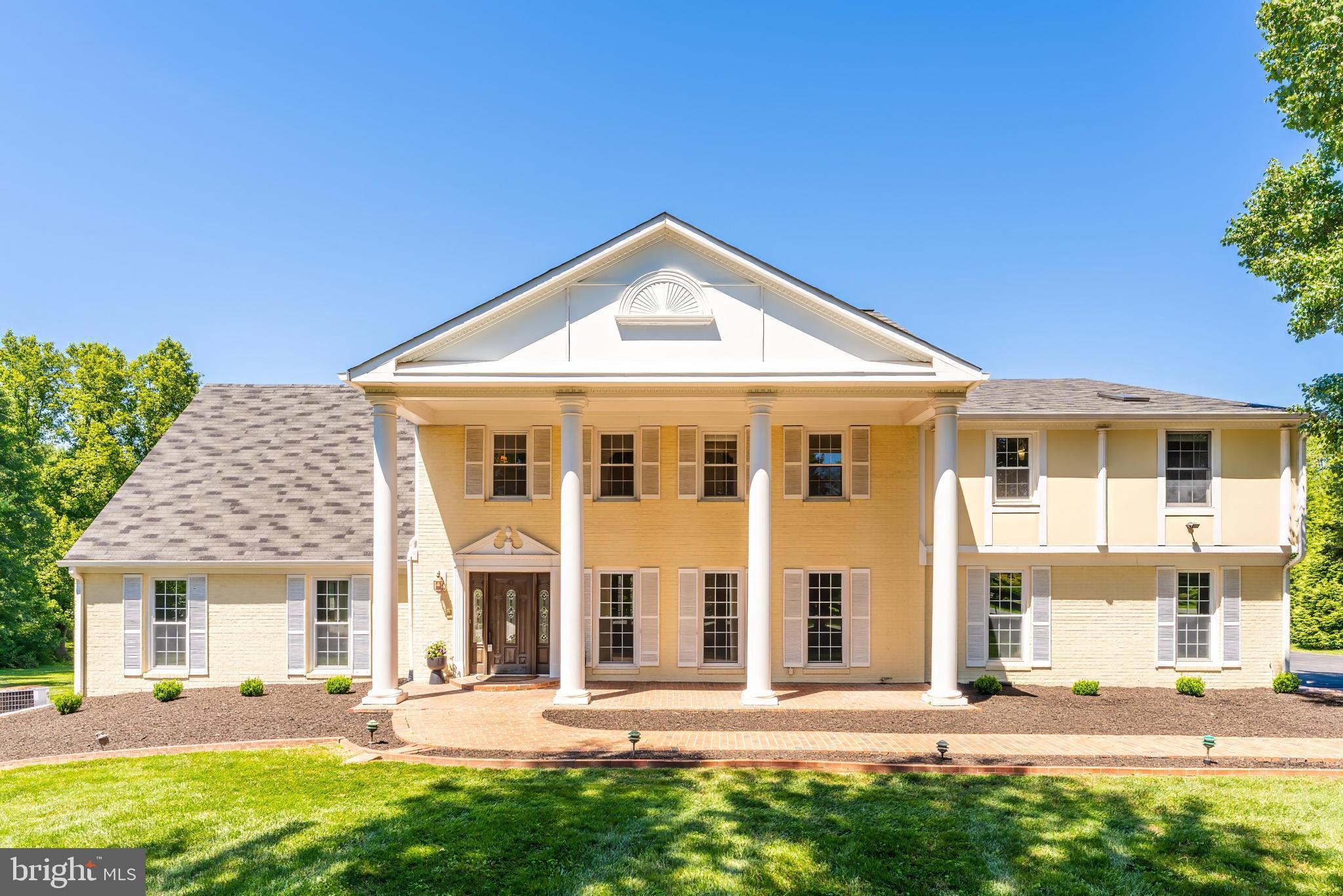 Join us Sunday, 6/28 from 12-2pm for an Open House! Introducing 10520 Hunting Crest, a stately brick colonial set on a private 2-acre homesite backing to mature trees, offering the perfect blend of tranquility and convenience. Tucked away on a quiet street with no cut-through traffic, this exceptional property provides a peaceful retreat just minutes from Vienna, Reston Town Center, and Tysons Corner. 

The beautifully landscaped grounds feature expansive, usable yard space, all enjoyed from the Trex deck and large patio, perfect for outdoor entertaining, dining al fresco, or simply taking in the peaceful natural surroundings.

Inside, spacious living areas showcase timeless craftsmanship with hardwood floors, custom built-ins, extensive moldings, and refined trim work throughout. Formal living and dining rooms lead to a grand, sun-drenched sunroom that serves as an entertainer's dream and offers endless possibilities for gathering, relaxing, or working from home.

At the heart of the home, the eat-in kitchen features custom cabinetry, abundant storage, and a large center island. Just beyond, a separate chef's kitchen and mudroom provide exceptional functionality and additional workspace for entertaining on any scale.

Upstairs, four generously sized bedrooms, each featuring walk-in closets, includes the luxurious primary suite with a spacious cedar walk-in closet and a spa-inspired bath retreat.

The expansive finished lower level adds incredible versatility with two additional bedrooms, a full bath, wet bar, and two large recreation areas complete with custom built-ins, abundant storage, and direct walk-out access to the backyard.

A two-car garage provides additional storage and convenience.

Located within the sought-after South Lakes High School pyramid and just minutes from Dulles International Airport, Route 7, I-495, and major commuter routes, this is a rare lifestyle property offering privacy, space, and accessibility in the heart of Northern Virginia.

Welcome home.