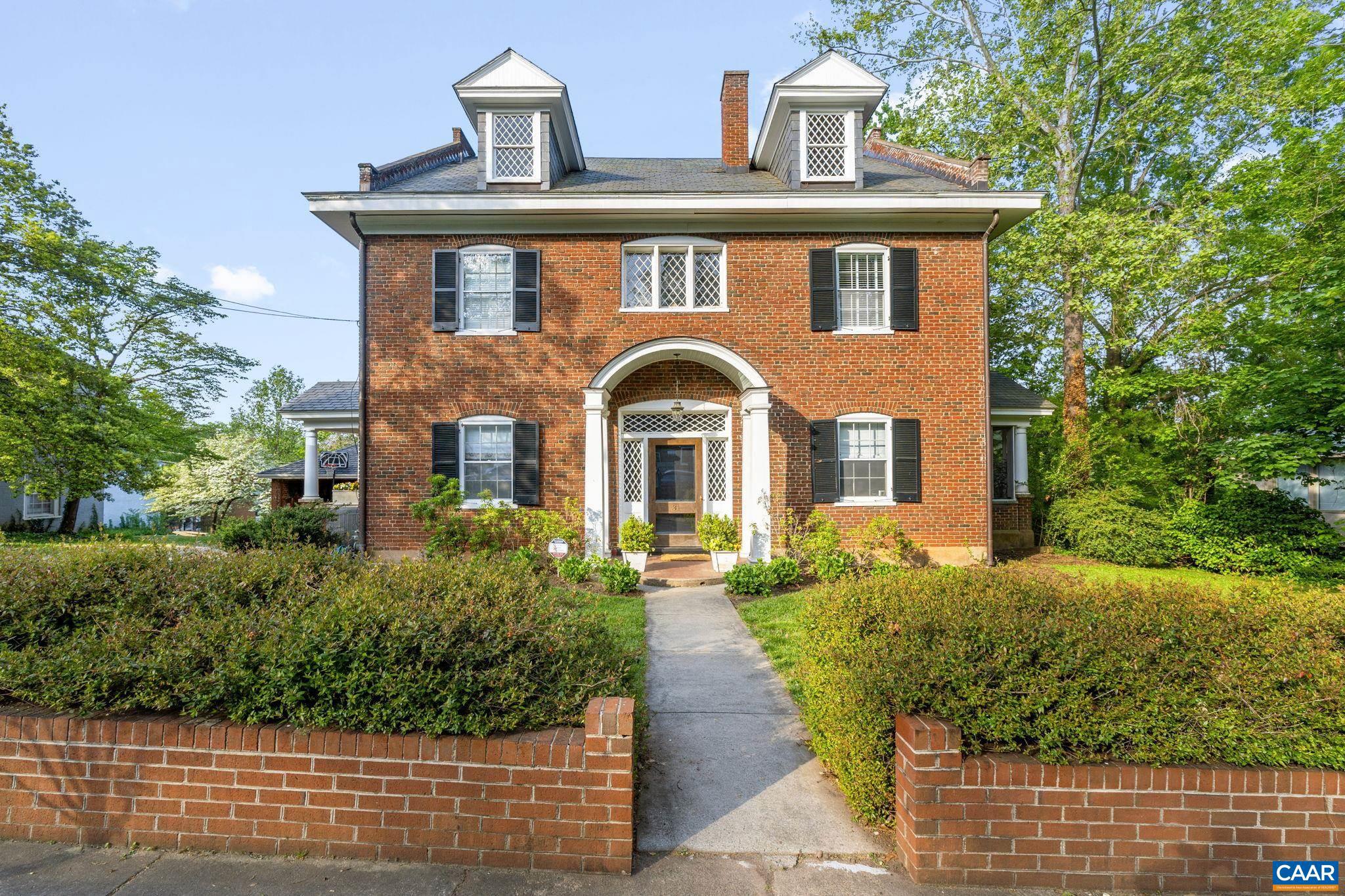 Don't miss this truly special property on an iconic circle just steps from the University! Spectacular Georgian Revival-style home feat. flemish bond brick exterior, slate roof, diamond shaped leaded glass windows + multiple porches.   Inside, CHARACTER at every turn in a grand 4-over-4 design w/ gracious spaces, dramatic 10' CEILINGS, heartpine floors + built-ins.  Recent RENOVATED KITCHEN + REIMAGINED PRIMARY SUITE inc. new stunning bathroom. 3 add'l bedrooms, sleeping porch + reading nook complete the 2nd flr.  Incredible potential to finish huge WALK-UP ATTIC with soaring ceilings (13 ft at ridge) or use now for storage.  Bright TERRACE LEVEL APARTMENT is ideal for add'l income or au pair/guest quarters.  Fantastic grassy backyard perfect for entertaining or play.  Ample off-street parking plus detached GARAGE. These homes rarely come available!,Cutting Board,Painted Cabinets,Fireplace in Living Room