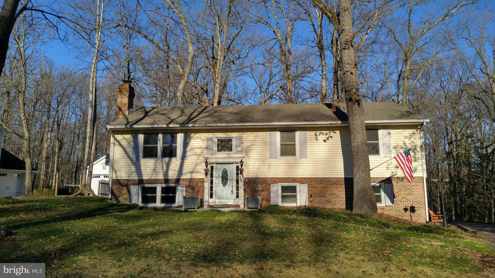 Wonderful, large home with tons of living space! Upper level has open floorplan with large living room that flows into a dining room and kitchen, both with vaulted ceilings and exposed beams over the kitchen. Large family room on the lower level with fireplace. Tons of natural light! Master bedroom has access to huge deck off the rear of the home. Enjoy spring and summer BBQing outdoors!