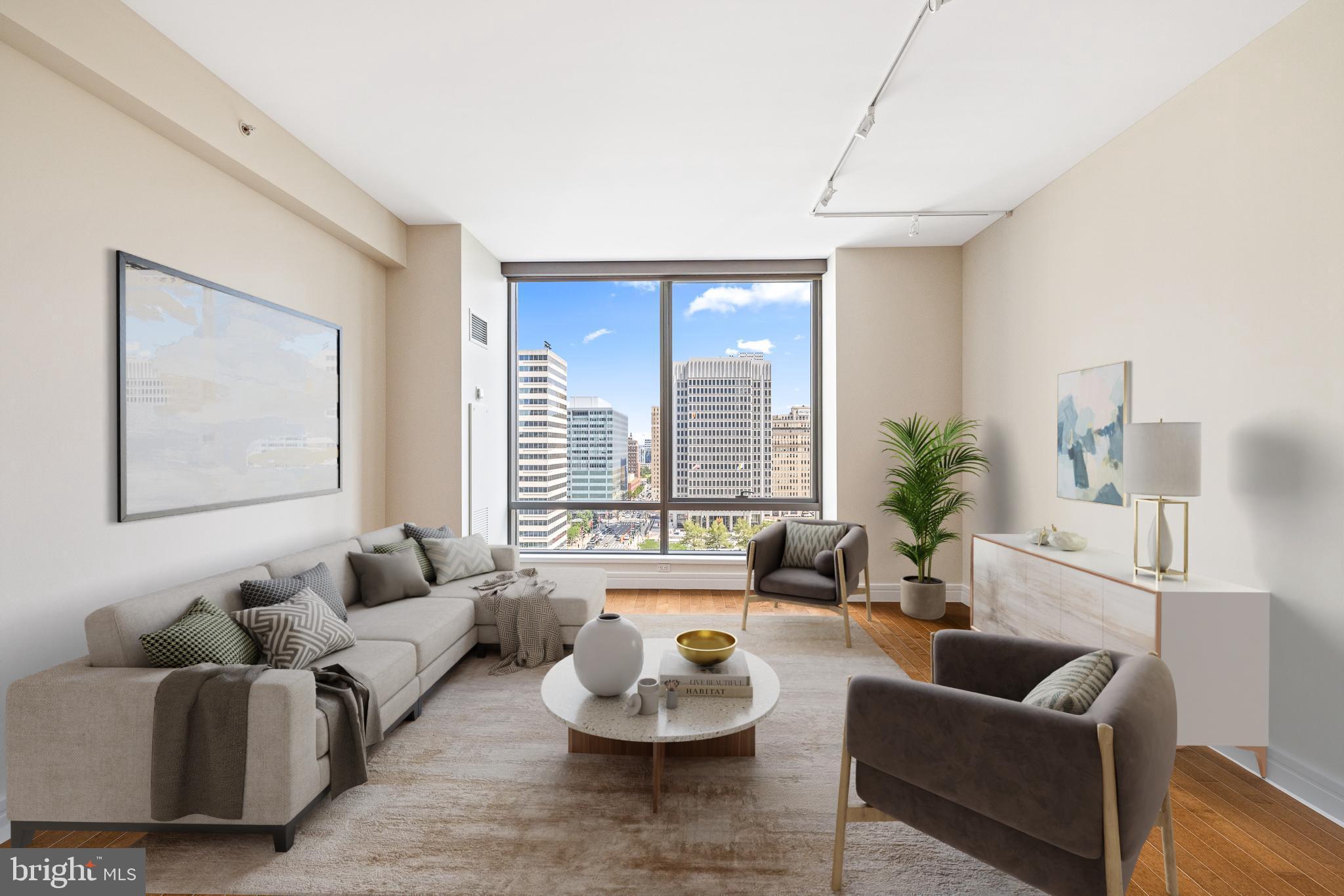 PARKING INCLUDED ESTIMATED VALUE $120,000! - Discover the epitome of luxury city living in this extraordinary 1-bedroom, 1.5-bath residence at The Ritz-Carlton Residences. A rare offering that includes a deeded parking space in the building’s private valet garage—an exceptional value of approximately $120,000. Positioned high above the city, this home offers floor-to-ceiling windows with sweeping views, where the iconic City Hall serves as the focal point and 9' ceilings.  The open kitchen features custom wood cabinetry, granite countertops, and top-tier appliances. The Calacatta marble primary bath includes a double vanity, seamless glass-enclosed shower, and a luxurious Bain Ultra soaking tub. Custom-fitted closets throughout add function and style. Residents enjoy access to an unmatched suite of amenities, including a luxury courtesy car and driver, valet service, and newly renovated terrace which includes multiple outdoor grills & dining areas and several outdoor lounge areas with fire-pits and much more, state-of-the-art fitness center, wellness room, and indoor pool & hot tub.  A brand new outdoor dog park offers a secure space for pets to play,  The recently redesigned resident lounge, private screening room, and catering kitchen redefine in-building luxury living. With direct access to the adjacent Ritz-Carlton Hotel through a private resident entrance, enjoy hotel dining, the spa, and even room service at your doorstep. This is a rare chance to own one of the city’s most refined residences, complete with every convenience—including valet parking—at your fingertips.  -  Some photos staged furnishings.