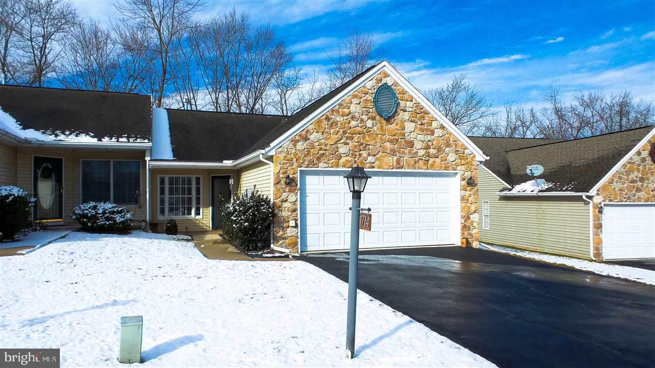 First Floor living - NO STEPS!  Maintenance free living!  Never mow or shovel again!  2 first floor brs, 2 first floor full bath, gas frplc in LR with Remote control & w/deck & steps to grade, Garage is heated, cooled & fully finished as it had been the model home, all appliances included! Covered front porch, excellent move in condition.