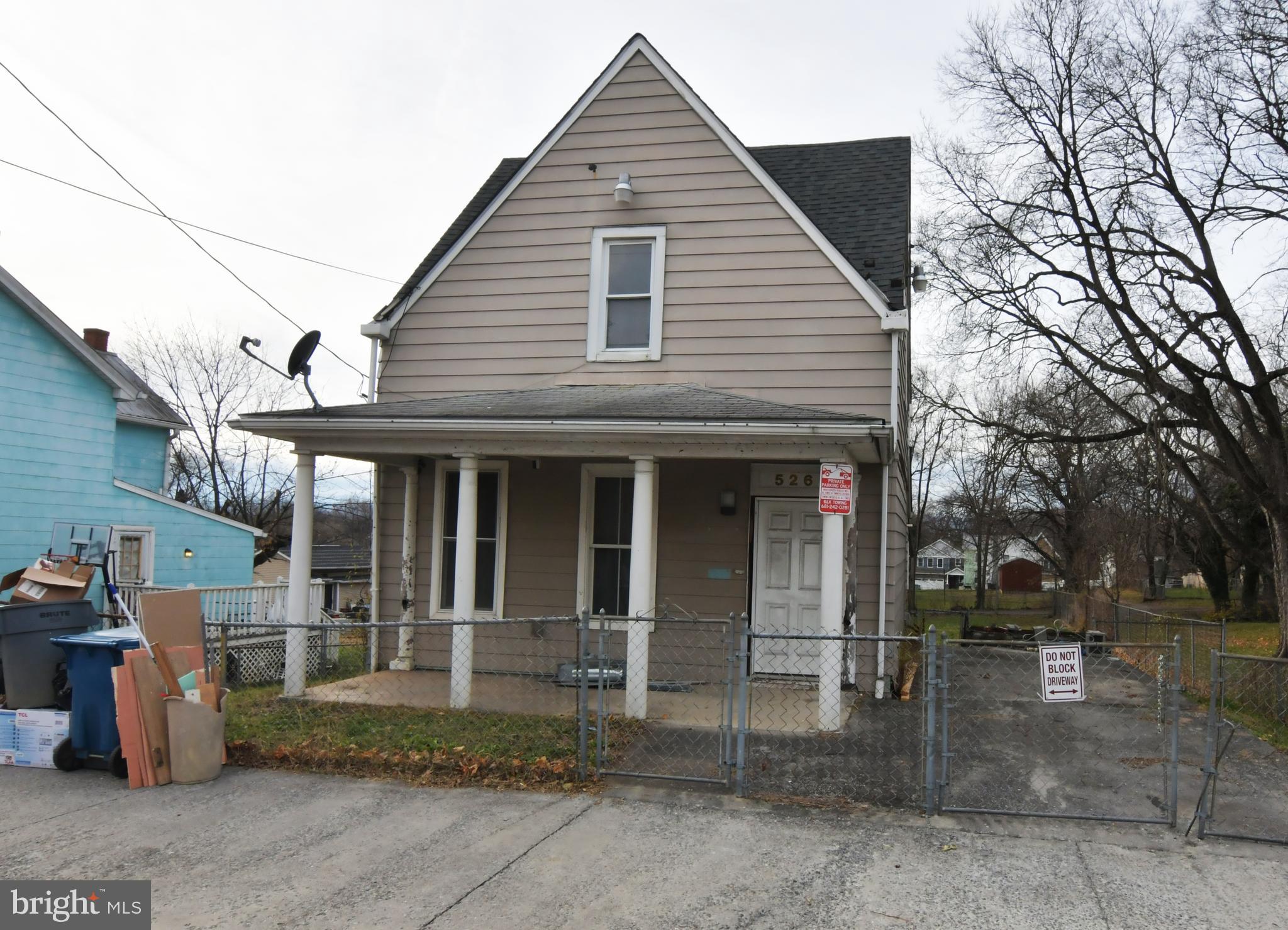 3-BEDROOM HOME WITH DEEP BACKYARD AND OFF-STREET PARKING. HARDWOOD FLOORS. GREAT OPPORTUNITY IN DOWNTOWN MARTINSBURG. EXCELLENT RENOVATION PROJECT FOR FLIPPERS AND OTHERS WHO ARE WILLING TO ROLL UP THEIR SLEEVES AND GET TO WORK. Sold strictly as-is, where-is. Cash only.  This is one of six houses in various stages of interior demo/reno being offered for sale by this owner. Six building lots also are for sale. The Eastern Panhandle is one of the fastest growing areas of West Virginia. Residents of Martinsburg and Berkeley County are attracted to the small-town atmosphere, employment opportunities, restaurants, shopping, services, medical facilities, a revitalizing downtown, and access to major roads I-81, Rt. 9 and Rt. 11, the MARC train and Amtrack. Lot sizes are approximate. Buyer to verify natural gas availability. Seller said price is firm.