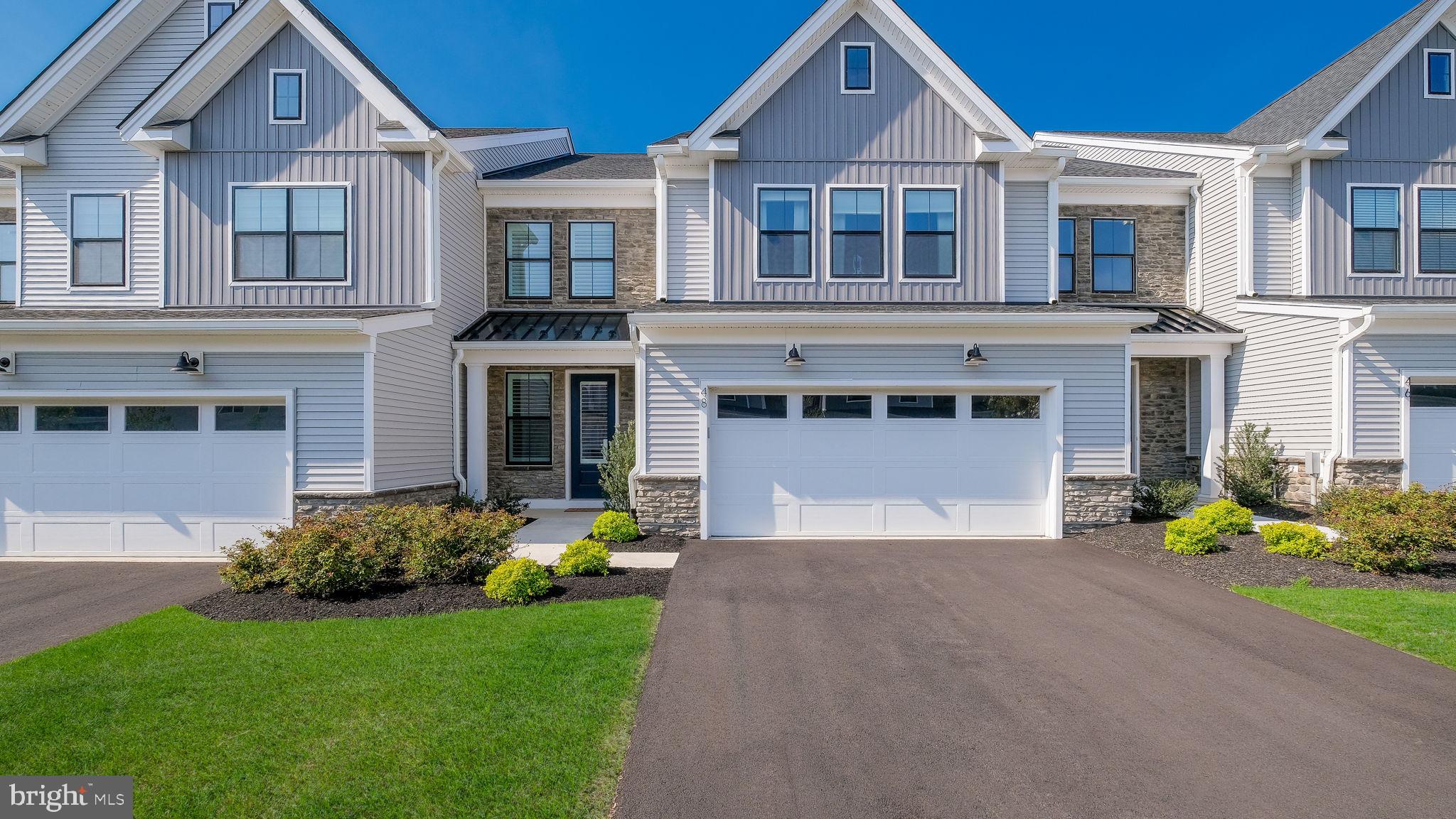 Nestled in the heart of charming Doylestown Walk, this Move-In Ready,  Luxury Carriage Home stands apart with its perfect fusion of modern sophistication and timeless elegance. Step inside, and you’ll immediately notice the meticulous attention to detail and high-end finishes & upgrades that elevate this home above the rest.

The gourmet kitchen is a standout feature, designed for both style and functionality. Boasting an oversized 12' x 4' island with plenty of seating, breakfast bar, sleek quartz countertops, an abundance of cabinetry with self-closing doors and drawers, under cabinet lighting, top-of-the-line appliances, six-burner gas cooktop, exposed hood vent, including a wall oven and built-in convection microwave. A butler’s pantry adds an extra layer of convenience, making entertaining a breeze.  Plus a walk-in pantry for all your storage needs. The open-concept main level is filled with natural light, thanks to expansive sliding glass doors that lead to a beautifully designed rear patio - your private escape for relaxing or hosting under the stars. The main living level also boasts 8" wide durable luxury vinyl plank flooring, recessed lighting throughout and an extended garage for storage and convenience. Including 9' foot ceilings on all levels of the home creating a grand & luxury feel throughout. 

Upstairs, the primary suite offers a serene retreat with its bright, airy ambiance and luxurious finishes. Complete with upgraded carpet & recessed lighting. The spacious primary bath has dual vanities, elegant tile throughout, frameless glass shower with bench seat, upgraded framed mirrors making this space a spa like experience. Plus a large walk-in closet, for all seasons. The upper-level loft provides flexibility for your lifestyle - imagine a cozy reading nook, a home office, or even a media room. Two additional bedrooms and a well-appointed laundry room complete this thoughtful layout, ensuring both comfort and practicality.

With its exceptional design and refined touches, this Luxury Carriage Home creates a lifestyle that’s hard to match. Don’t miss the chance to experience it for yourself -schedule your private tour today!