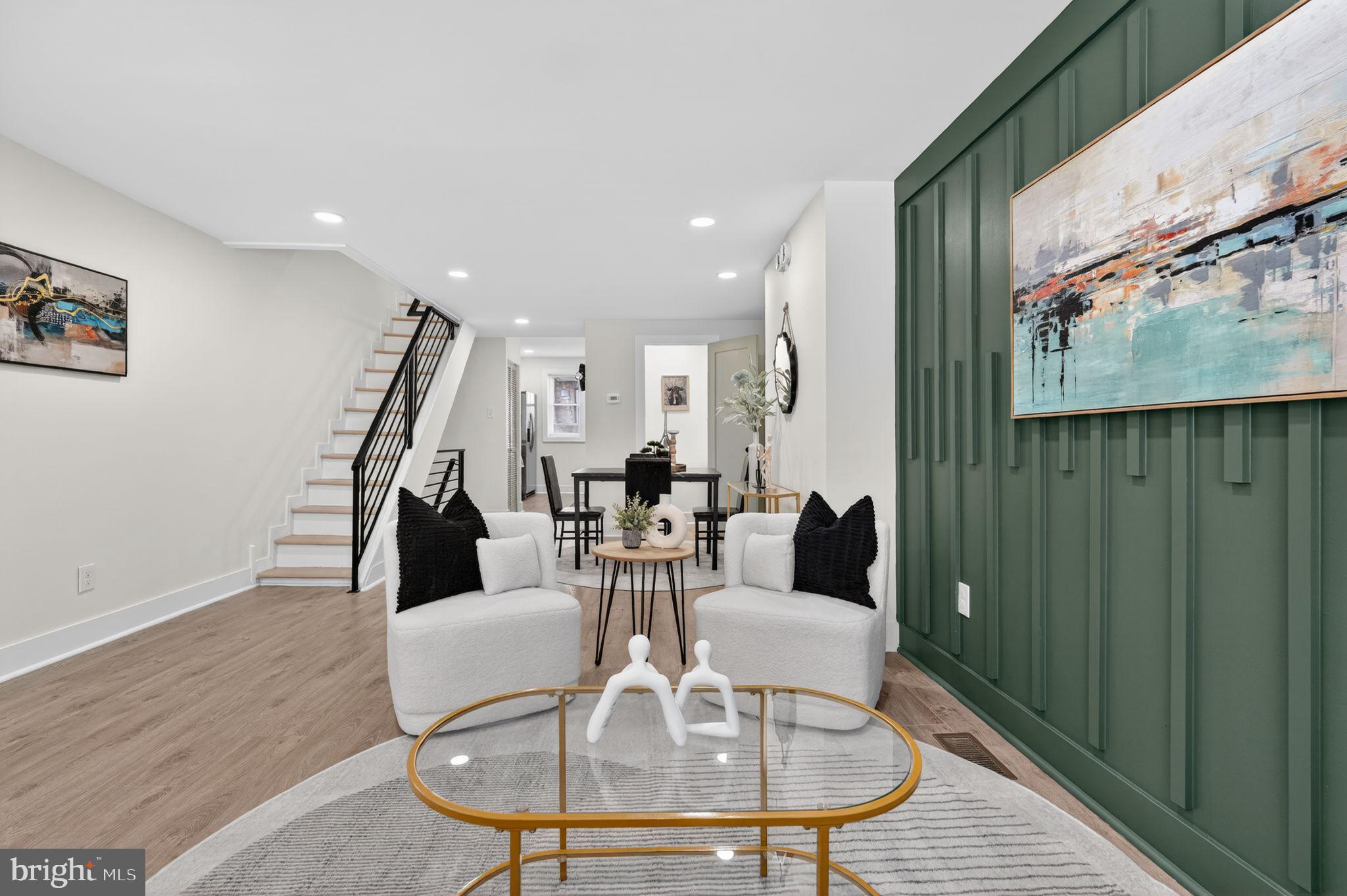 Welcome to 2536 South Phillips Street, a beautifully renovated three-bedroom, one-and-a-half-bathroom home located in the heart of South Philadelphia’s highly desirable 19148 zip code. This move-in-ready property features brand new laminate wood flooring throughout the entire home, spanning the living room, dining room, kitchen, and all three spacious bedrooms on the second floor. The interior is elevated with stylish, colorful accent walls and trendy modern interior doors that add character and a contemporary feel throughout.
The fully renovated kitchen is a true standout, showcasing a sleek two-tone design with white shaker cabinets on the upper level and rich wood-tone shaker cabinetry below, perfectly paired with granite countertops and a ceramic tile backsplash. A farmhouse sink with a chic, designer faucet serves as a centerpiece, complemented by a full suite of stainless steel appliances, making this kitchen as functional as it is visually impressive.
Upstairs, you’ll find three generously sized bedrooms, including a primary bedroom with ample closet space. The full bathroom on the second floor has been completely renovated with modern finishes, while a conveniently located and fully updated half bathroom sits on the main level. Additional upgrades include brand new central air conditioning, ensuring comfort year-round.
This thoughtfully updated home blends modern design with practical living and is ideally situated close to local shops, dining, and transportation. Don’t miss your opportunity to own a turnkey property in one of South Philadelphia’s most sought-after neighborhoods.