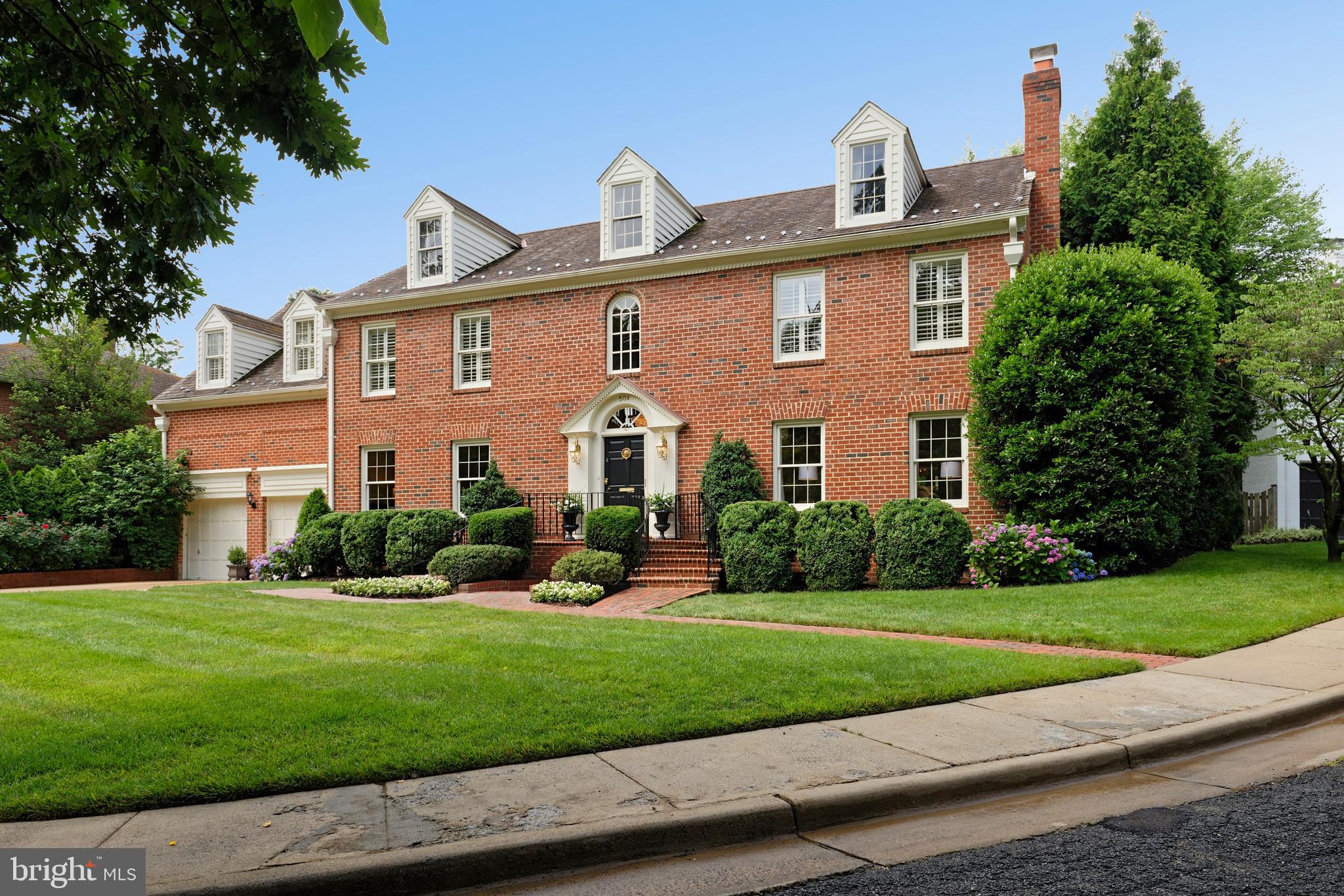 This rare 6,000sf Georgian Beauty with its quiet elevator is located on a private lane across from a lush park. The exquisite landscaping surrounding the heated pool and patio creates a Garden-of-Eden-like magnificence to the property. Floor-to-ceiling windows and doors across the back bring the splendor inside where its elegant foyer, five fireplaces, and huge rooms make this home wonderfully warm and inviting. With the HOA owning both the lane and the park, a quiet existence away from developers and traffic completes the package. The master enjoys a balcony, fireplace, and two baths, one beautifully renovated with Carrara marble, the other with its own sauna. Other special features: two new retractable awnings & pool changing room with full bath; walk-in cedar closet with a safe; a separate, elegant entrance to the lower foyer which opens to a beautiful guest room/office with fireplace, both with slate floors; and an extensive irrigation system. The brick pathway is freshly repointed; carpets are new; washer & dryer are new; the generator covers half the house. The location: easy access to Shirlington Exit of 395; two miles on side streets to Amazon HQ2; walk to St Stephens & St Agnes lower school and to George Mason Elementary.