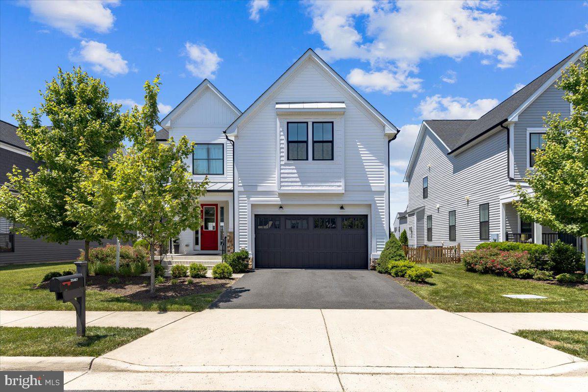 Rare opportunity to own a beautifully appointed Van Metre Parr model in Prosperity Plains, an exclusive community of fewer than 100 single-family homes. This hidden Gem was built in 2019 and offering over 4,400 square feet, this exceptional gem combines modern design, generous living spaces, and a highly desirable Loudoun County location.
The bright, open main level is designed for both everyday living and entertaining. At the center of the home is a stunning gourmet kitchen featuring an oversized island, extensive cabinetry, and ample workspace. The kitchen flows seamlessly into the family room and dining area, creating an inviting gathering space filled with natural light. A versatile flex room provides options for a home office, playroom, study, or additional living space. The spacious walk-in pantry and thoughtfully designed mudroom offer the storage and functionality today's buyers appreciate.
Upstairs, you'll find four spacious bedrooms and three full bathrooms, including a luxurious primary suite with dual custom walk-in closets and a spa-inspired bath. A generously sized secondary suite includes its own private bath and walk-in closet, while the additional bedrooms share a well-appointed hall bath. The conveniently located upper-level laundry room adds everyday convenience.
The finished lower level expands the home's versatility with a large recreation room, full bathroom, and two additional legal bedrooms with egress windows. Multiple storage areas and a spacious utility room provide plenty of room for organization.
Situated on one of the community's most desirable lots, the outdoor space is both functional and low maintenance, featuring a large concrete patio and level backyard. As an added benefit, front and rear landscape maintenance is included through the HOA.
Community amenities include a clubhouse, fitness center, outdoor pool, walking and running trails, and a variety of neighborhood events throughout the year. The property is located within the John Champe High School pyramid and offers convenient access to Liberty Elementary School, Dulles Landing, shopping, dining, commuter routes, and major employment centers.
Homes in Prosperity Plains rarely become available. With six bedrooms, four and a half baths, and an ideal blend of luxury, comfort, and convenience, this is a home you won't want to miss.