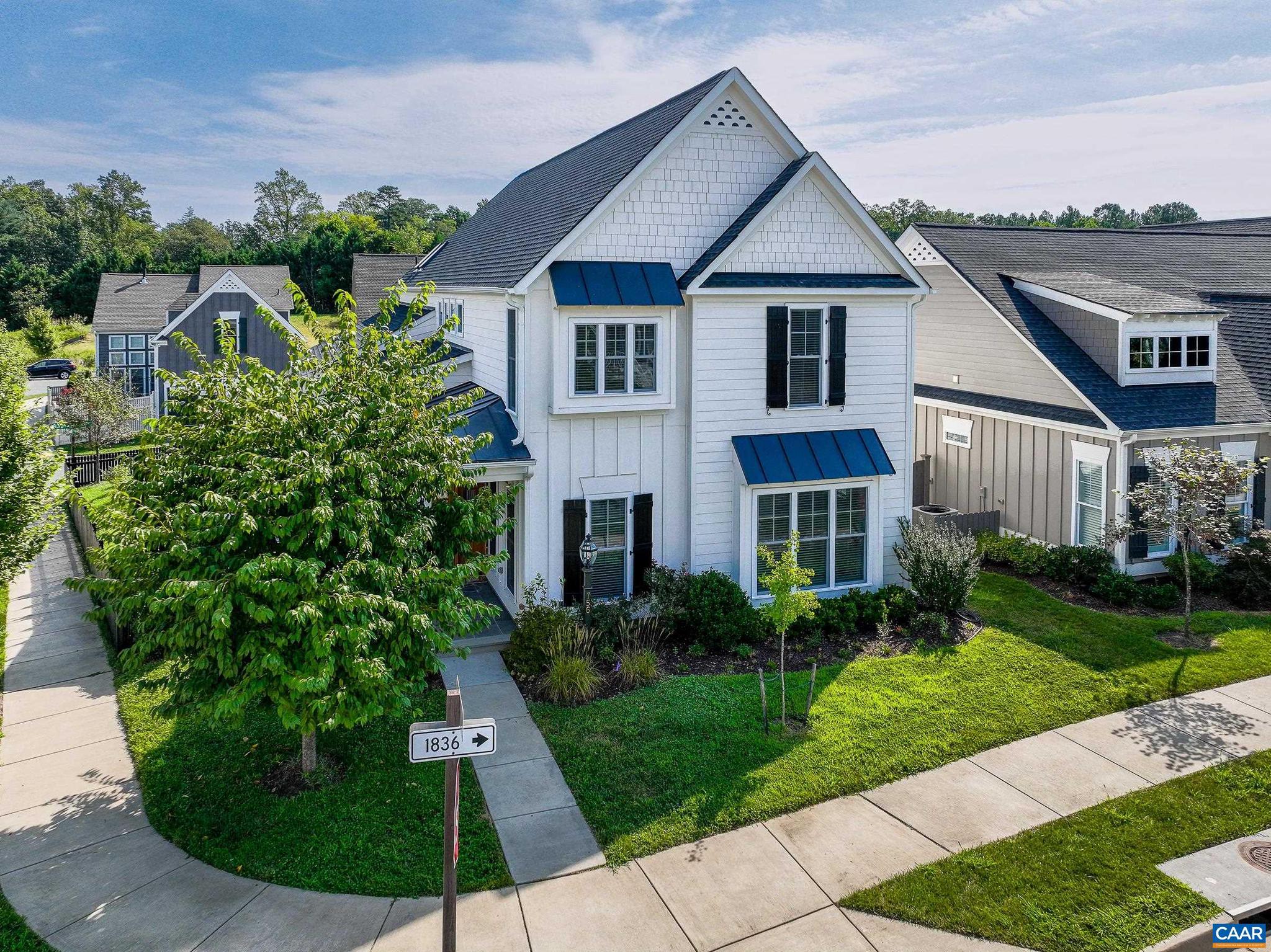 OPEN HOUSE-This SATURDAY & SUNDAY 12-2. Craig Builder home with charm and quality throughout. 4 bedrooms and 2.5 baths. Gorgeous kitchen with coffered ceiling, upgraded appliances. Kitchen Aid Microwave, Convection-Oven, Air-Fryer, Oven (11/24). KitchenAid Refrigerator (11/24). Bosch Dishwasher (2026). Kitchen has a wrap-around breakfast bar which is perfect for entertaining. Two car-garage with storage. Mud room with built-ins. Beautiful primary suite with bath and large walk-in closet. Laundry room has a utility sink and the loft has lots of natural light. The spacious family room on the main level has a large walk-in closet and roughed-in plumbing which could easily be converted to a full bath for a main-level primary suite. Enjoy entertaining in the formal dining room with extensive moldings. The office offers a quiet place to work from home. The living room features a see-through gas fireplace to the screened porch with beautiful stone masonry work. Fenced yard, raised garden bed, newly installed slate patio and a peach tree! Easy walk to community pool, shops and restaurants. HERS Score 69- energy efficient home, guaranteeing maximum utility savings. Low maintenance courtyard home. HOA provides mowing inside fence too!
